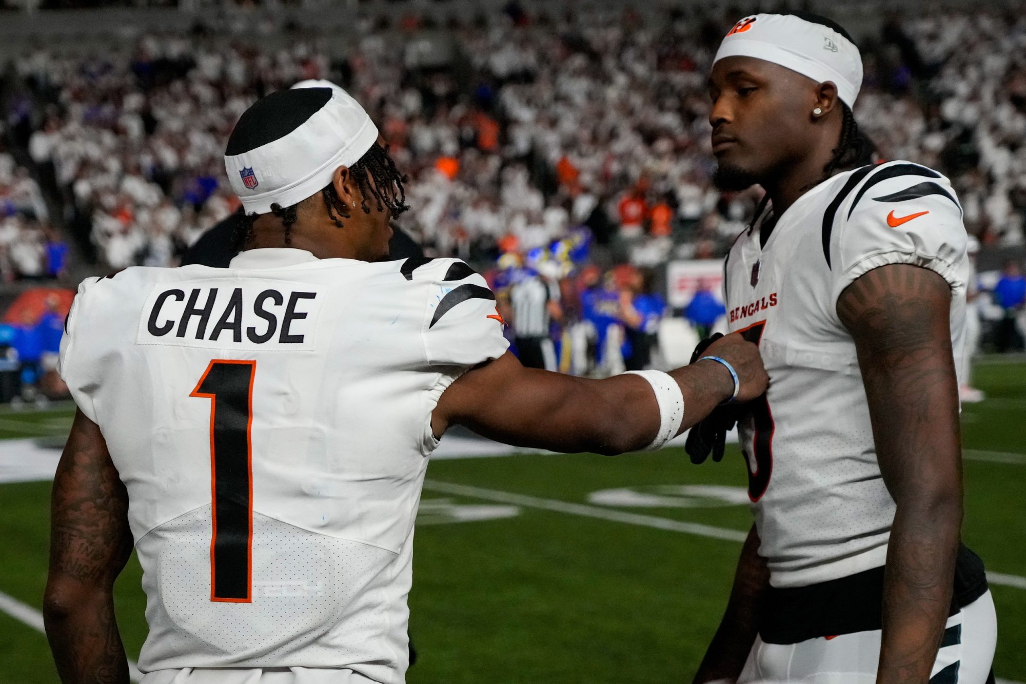 Sep 25, 2023; Cincinnati, Ohio, USA; Cincinnati Bengals wide receiver Ja'Marr Chase (1) and wide receiver Tee Higgins (5) talk on the sideline in the fourth quarter of the NFL Week 3 game between the Cincinnati Bengals and the Los Angeles Rams at Paycor Stadium.