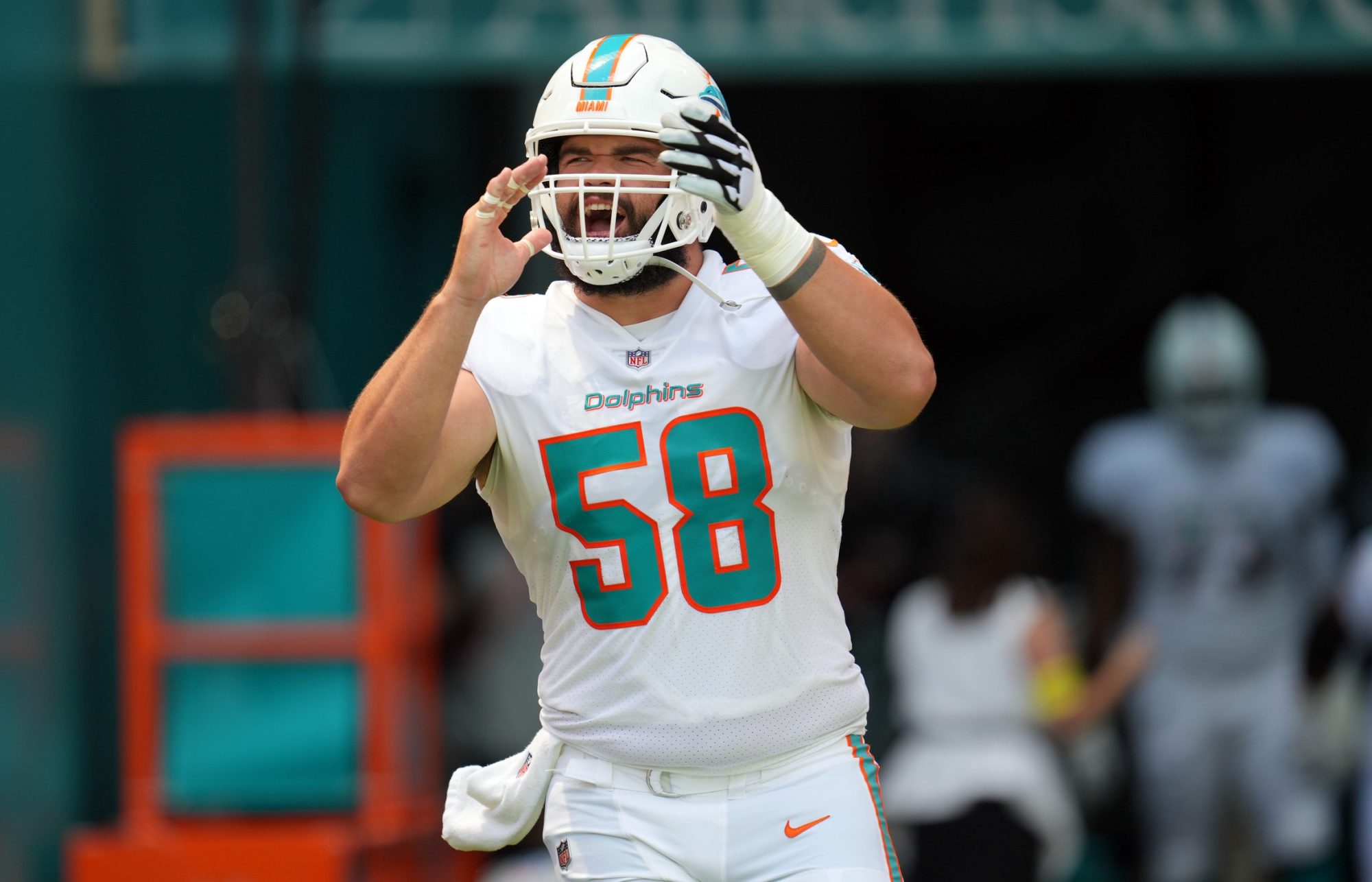 Miami Dolphins guard Connor Williams (58) takes the field before the opening game of the season against the New England Patriots at Hard Rock Stadium in Miami Gardens, Sept. 11, 2022.