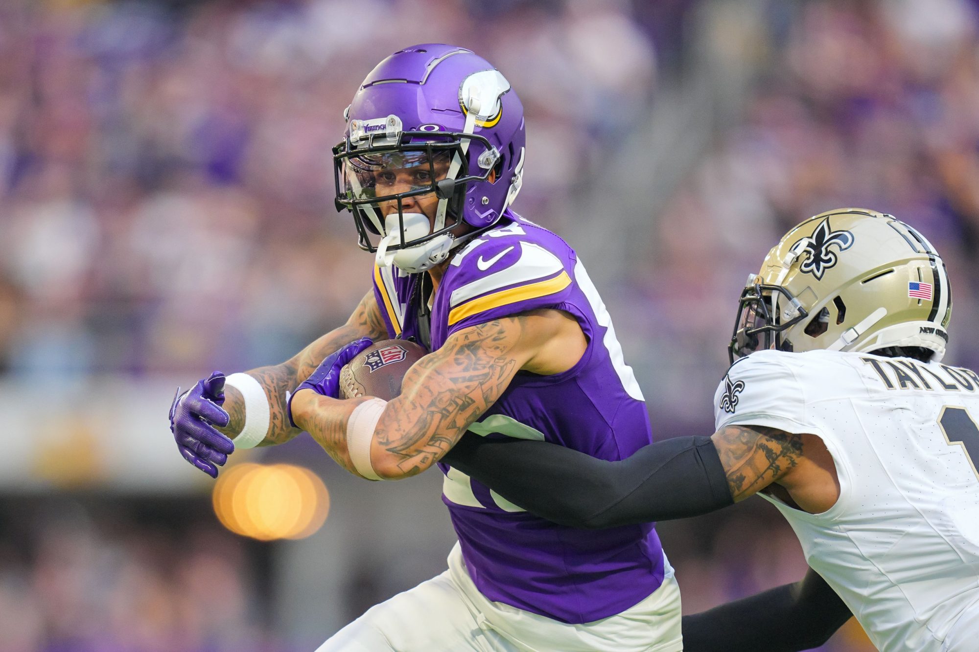 Nov 12, 2023; Minneapolis, Minnesota, USA; Minnesota Vikings wide receiver Jalen Nailor (83) catches a pass against the New Orleans Saints cornerback Alontae Taylor (1) in the third quarter at U.S. Bank Stadium.