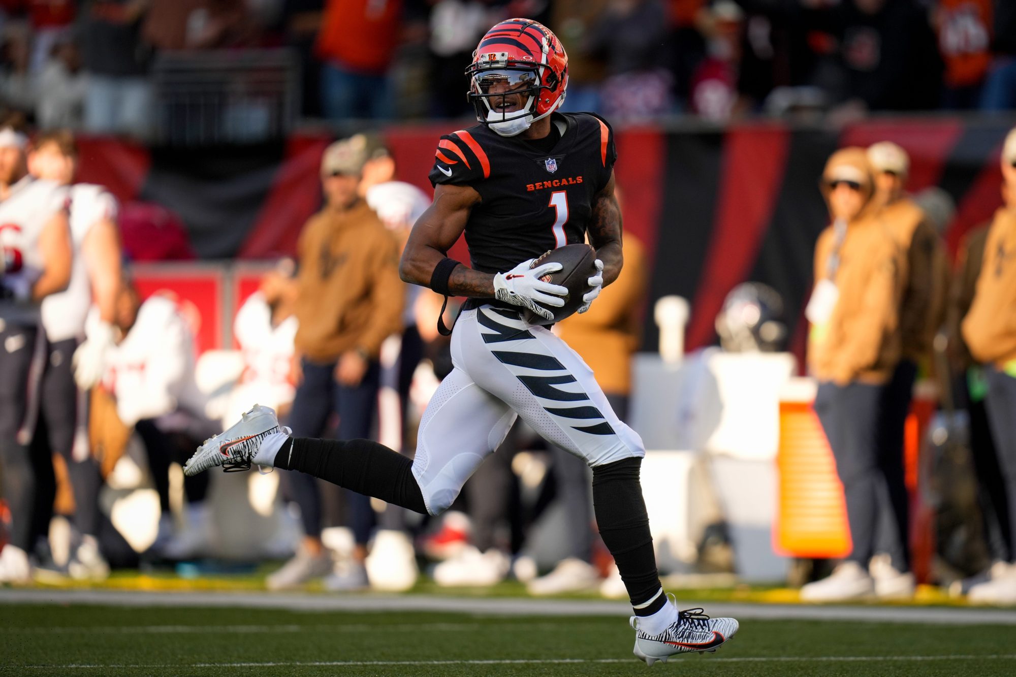 Cincinnati Bengals wide receiver Ja'Marr Chase (1) runs away with the ball on a touchdown reception in the third quarter of the NFL Week 10 game between the Cincinnati Bengals and the Houston Texans at Paycor Stadium in downtown Cincinnati on Sunday, Nov. 12, 2023.