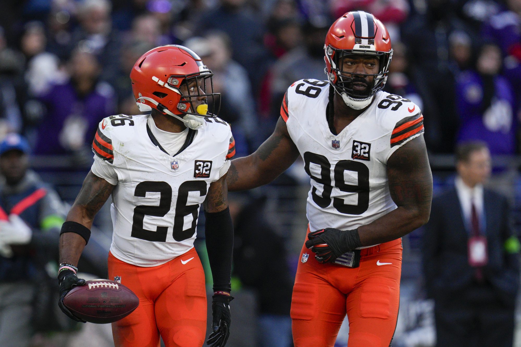 Nov 12, 2023; Baltimore, Maryland, USA; Cleveland Browns safety Rodney McLeod (26) celebrates a defensive play against the Baltimore Ravens with defensive end Za'Darius Smith (99) during the second half at M&T Bank Stadium.