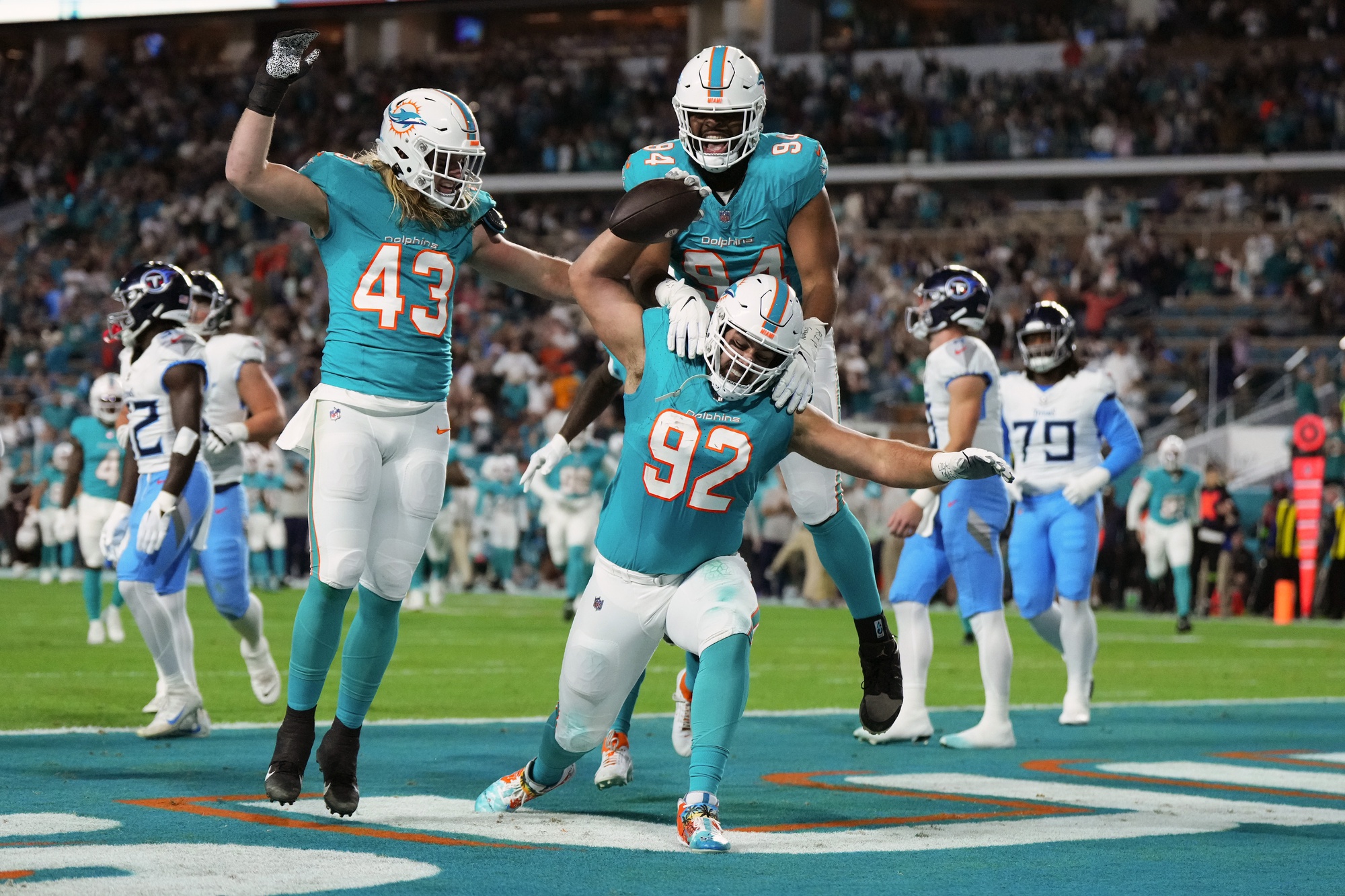 Dec 11, 2023; Miami Gardens, Florida, USA; Miami Dolphins defensive tackle Zach Sieler (92) celebrates his touchdown after intercepting a pass from Tennessee Titans quarterback Will Levis (not pictured) during the first half at Hard Rock Stadium.