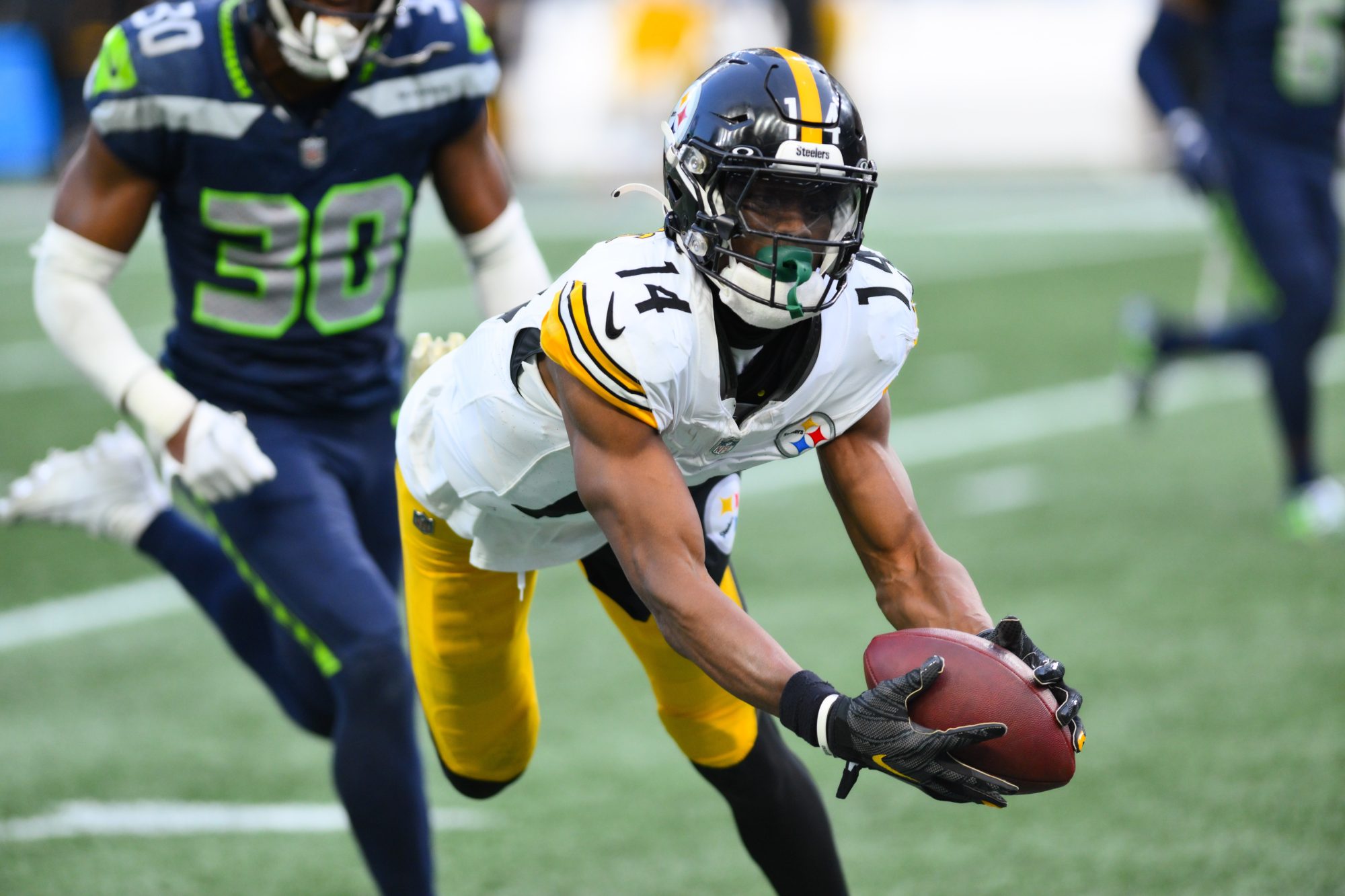 Dec 31, 2023; Seattle, Washington, USA; Pittsburgh Steelers wide receiver George Pickens (14) catches a pass against the Seattle Seahawks during the second half at Lumen Field.