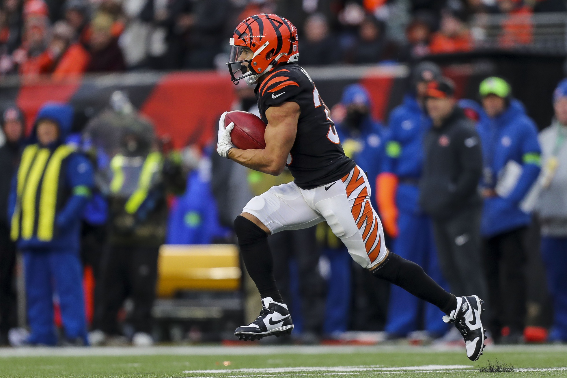 Jan 7, 2024; Cincinnati, Ohio, USA; Cincinnati Bengals running back Chase Brown (30) returns the kick off against the Cleveland Browns in the second half at Paycor Stadium.