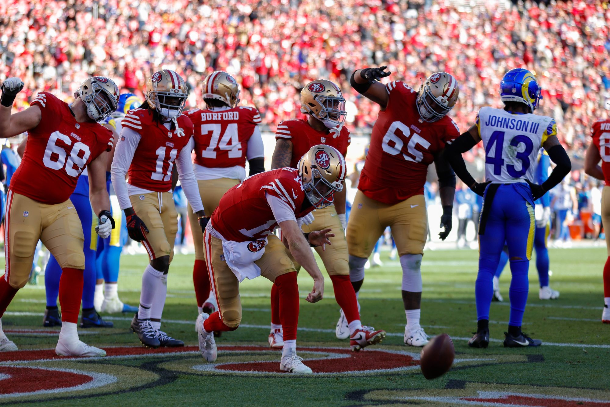 Jan 7, 2024; Santa Clara, California, USA; San Francisco 49ers quarterback Sam Darnold (14) scores a touchdown during the second quarter against the Los Angeles Rams at Levi's Stadium.