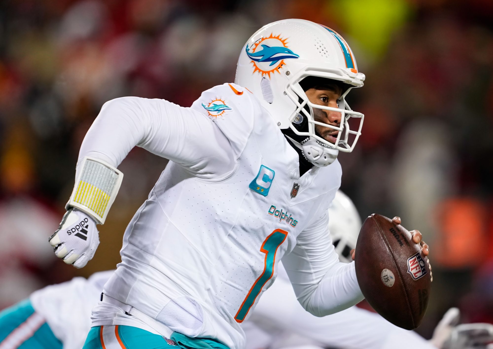 Jan 13, 2024; Kansas City, Missouri, USA; Miami Dolphins quarterback Tua Tagovailoa (1) during the second half of a 2024 AFC wild card game against the Kansas City Chiefs at GEHA Field at Arrowhead Stadium.