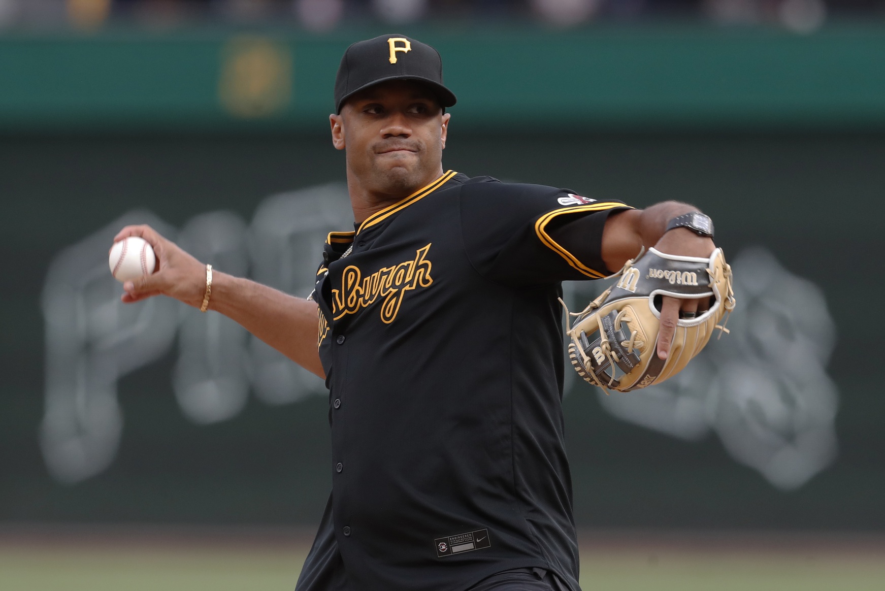 Apr 19, 2024; Pittsburgh, Pennsylvania, USA; Pittsburgh Steelers quarterback Russell Wilson (3) throws out a ceremonial first pitch before the Pittsburgh Pirates host the Boston Red Sox at PNC Park.