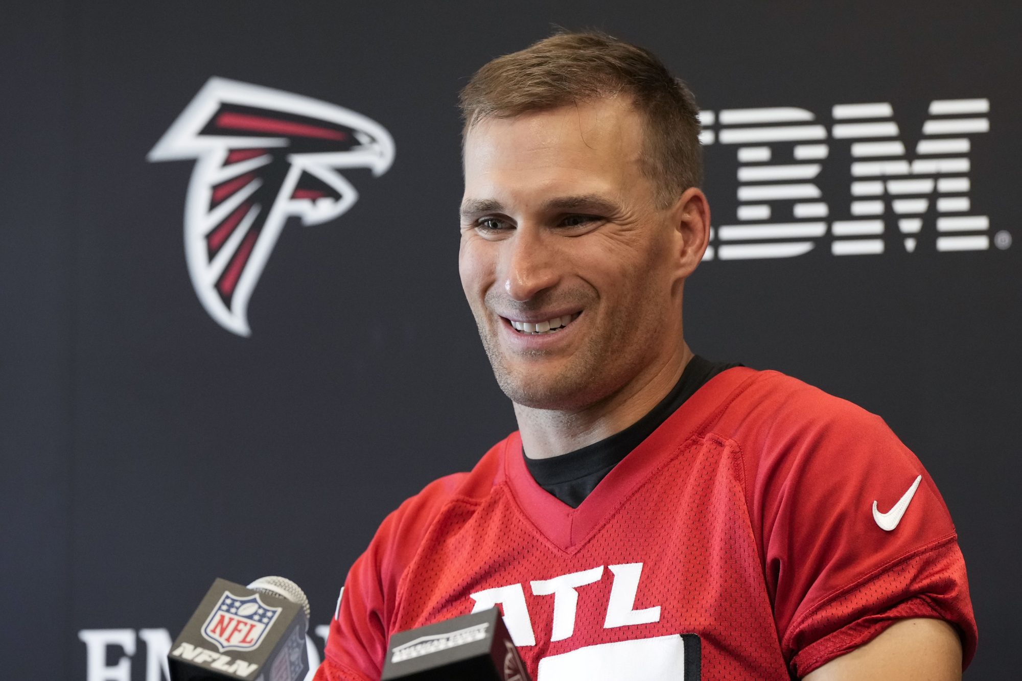 Jun 3, 2024; Atlanta, GA, USA; Atlanta Falcons quarterback Kirk Cousins (18) is interviewed after Falcons OTA at the Falcons Training facility.