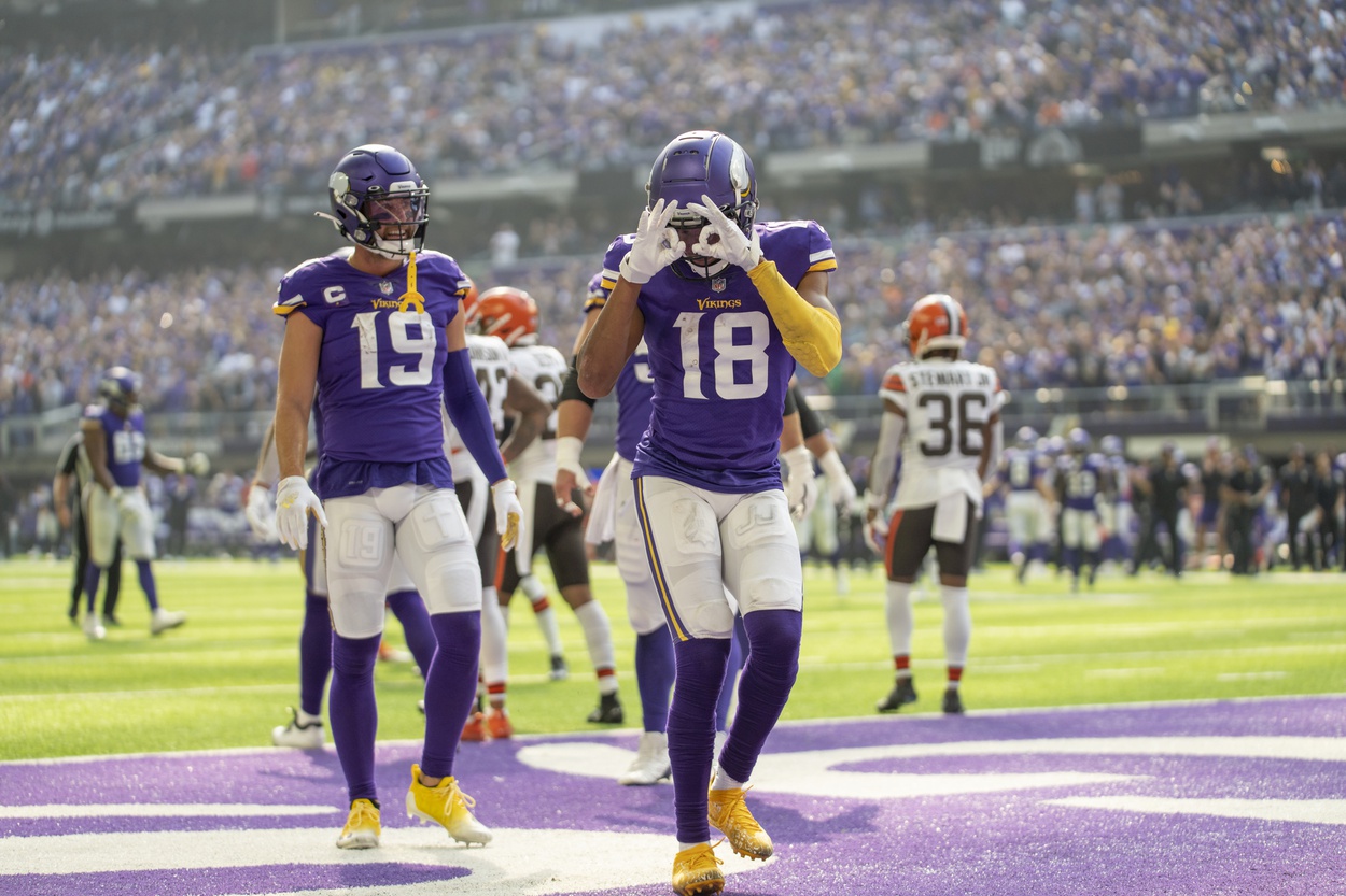 Oct 3, 2021; Minneapolis, Minnesota, USA; Minnesota Vikings wide receiver Adam Thielen (19) congratulates wide receiver Justin Jefferson (18) who is celebrating a touchdown reception from quarterback Kirk Cousins (8) against the Cleveland Browns in the first quarter at U.S. Bank Stadium.