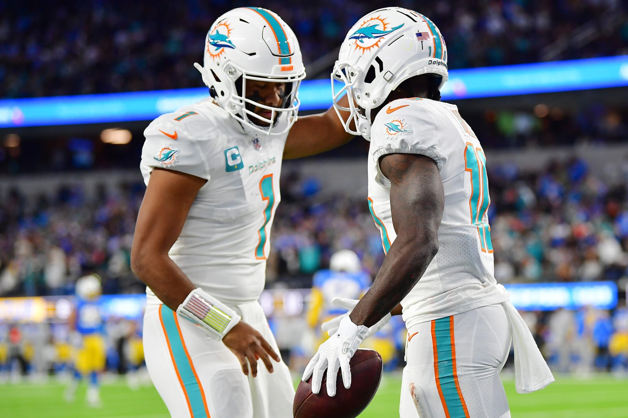 Dec 11, 2022; Inglewood, California, USA; Miami Dolphins wide receiver Tyreek Hill (10) celebrates his touchdown scored against the Los Angeles Chargers with quarterback Tua Tagovailoa (1) during the first half at SoFi Stadium.