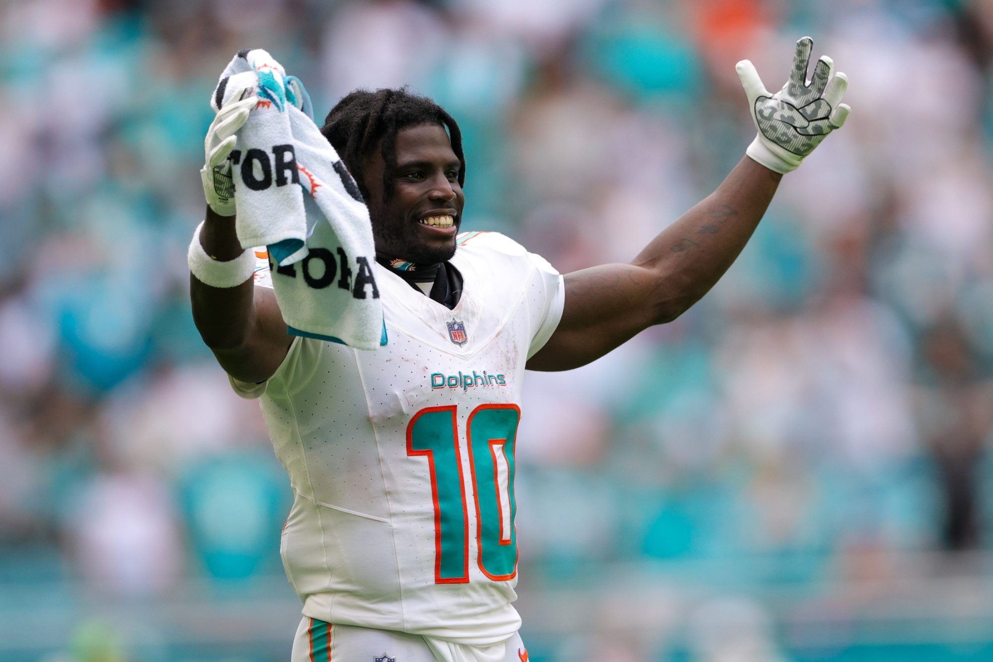 Sep 24, 2023; Miami Gardens, Florida, USA; Miami Dolphins wide receiver Tyreek Hill (10) looks on from the sidelines against the Denver Broncos in the fourth quarter at Hard Rock Stadium.