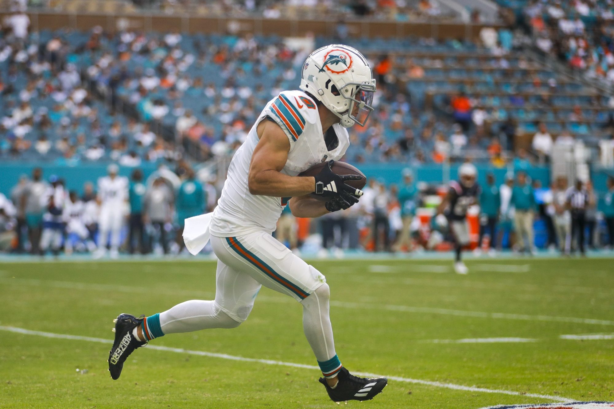 Oct 29, 2023; Miami Gardens, Florida, USA; Miami Dolphins wide receiver Braxton Berrios (0) runs with the football against the New England Patriots during the fourth quarter at Hard Rock Stadium.