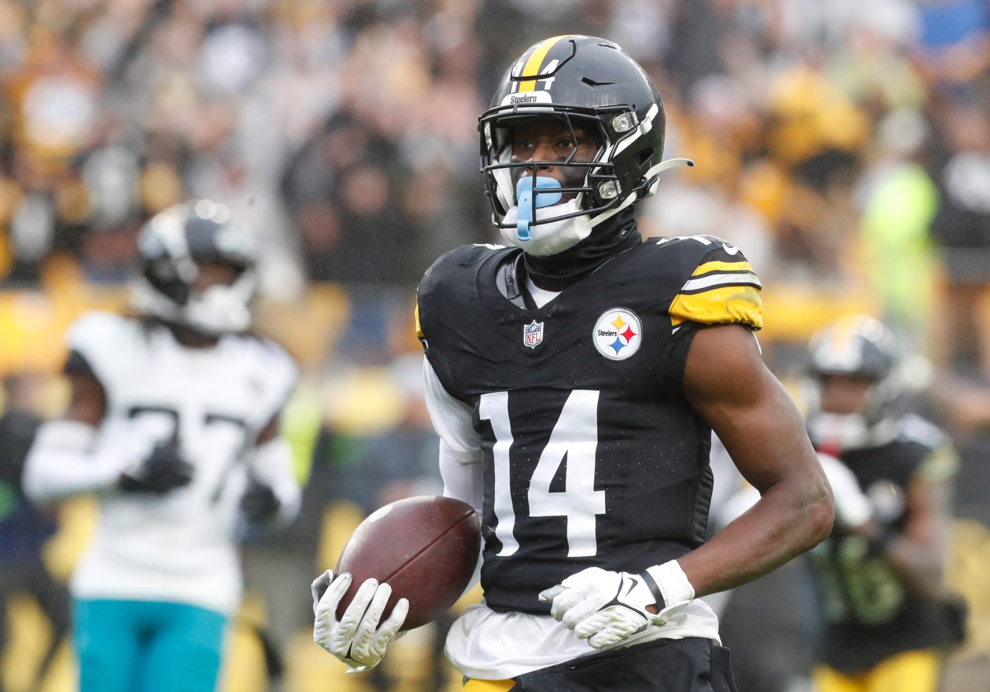 Oct 29, 2023; Pittsburgh, Pennsylvania, USA; Pittsburgh Steelers wide receiver George Pickens (14) runs to score a touchdown on a pass reception against the Jacksonville Jaguars during the third quarter at Acrisure Stadium.