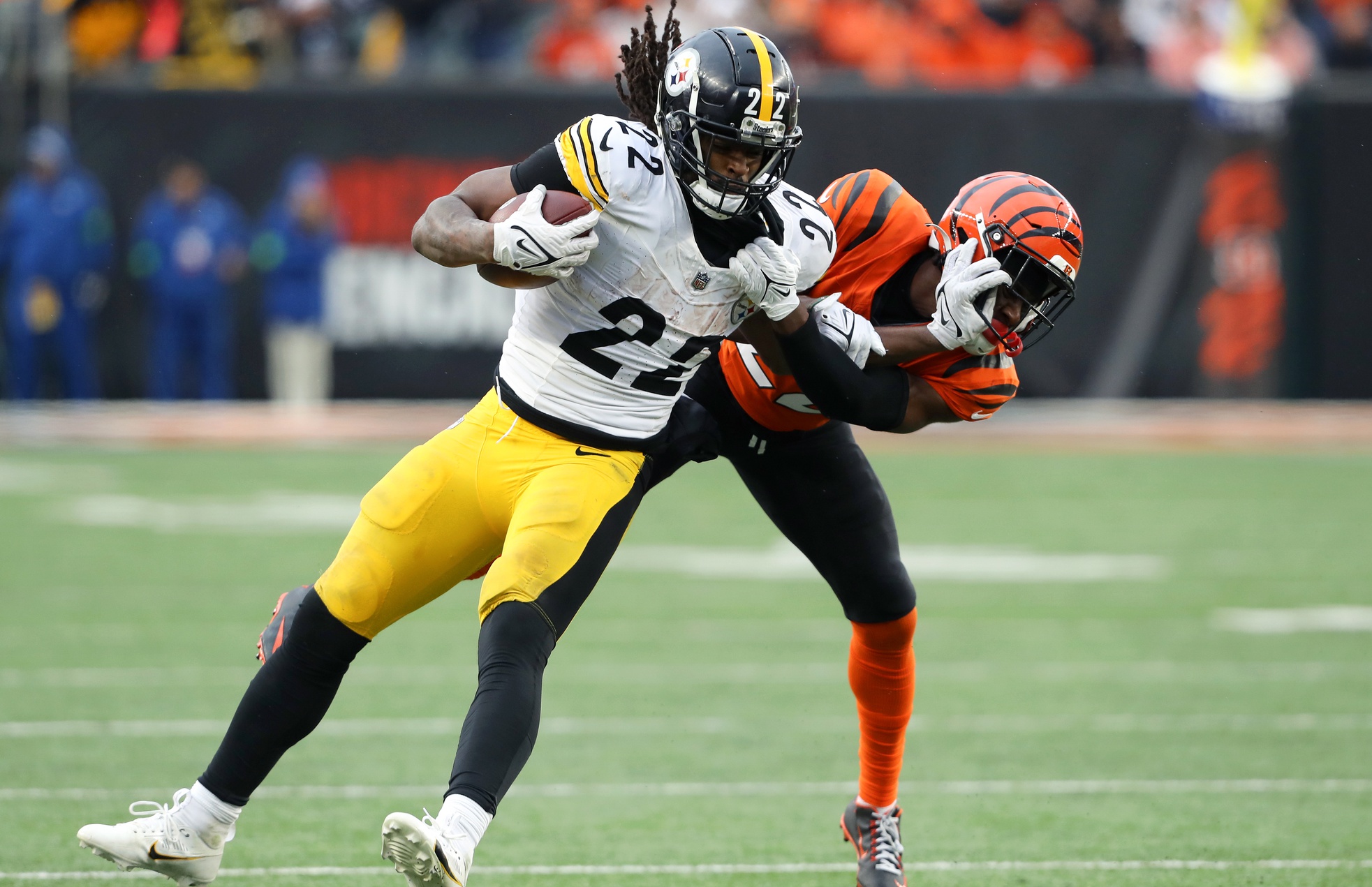 Nov 26, 2023; Cincinnati, Ohio, USA; Pittsburgh Steelers running back Najee Harris (22) runs the ball as Cincinnati Bengals cornerback Chidobe Awuzie (22) tackles during the fourth quarter at Paycor Stadium.