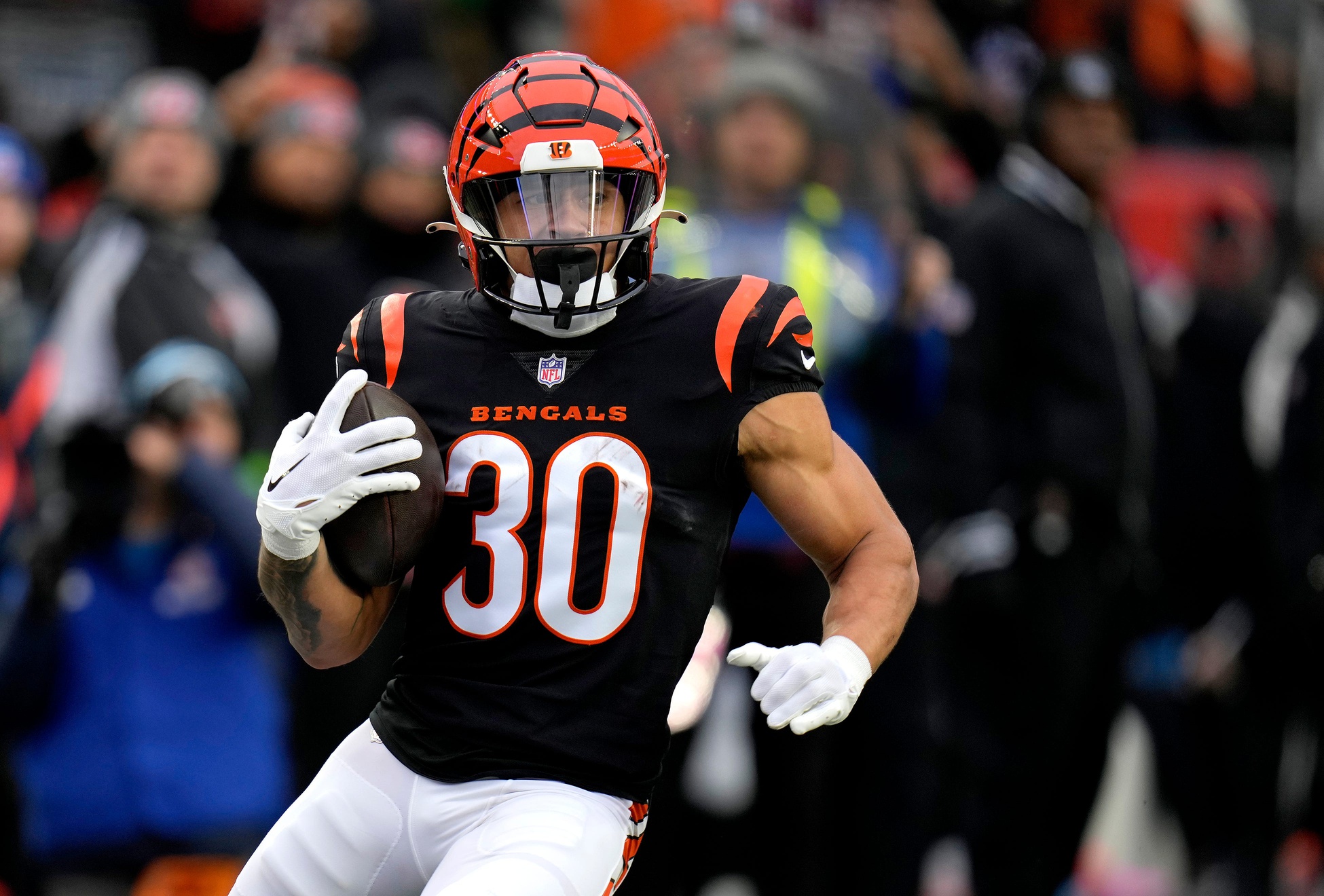 Cincinnati Bengals running back Chase Brown (30) runs 57 years for a touchdown in the first quarter during a Week 14 NFL against the Indianapolis Colts Sunday, December 10, 2023, at Paycor Stadium in Cincinnati.