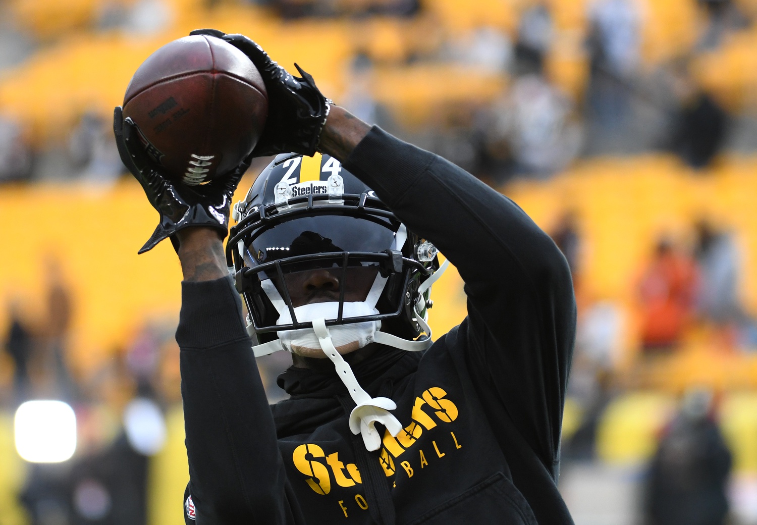 Dec 23, 2023; Pittsburgh, Pennsylvania, USA; Pittsburgh Steelers cornerback Joey Porter, Jr. (24) hauls in a practice ball before playing the Cincinnati Bengals at Acrisure Stadium.