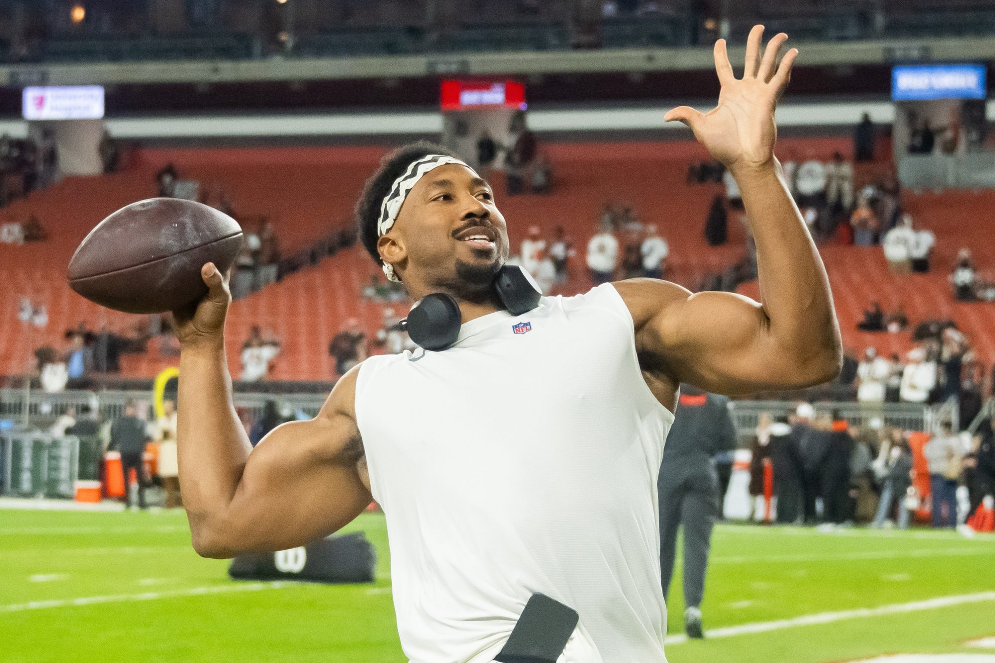 Dec 28, 2023; Cleveland, Ohio, USA; Cleveland Browns defensive end Myles Garrett (95) throws a football to fans before the game between the Browns and the New York Jets at Cleveland Browns Stadium.