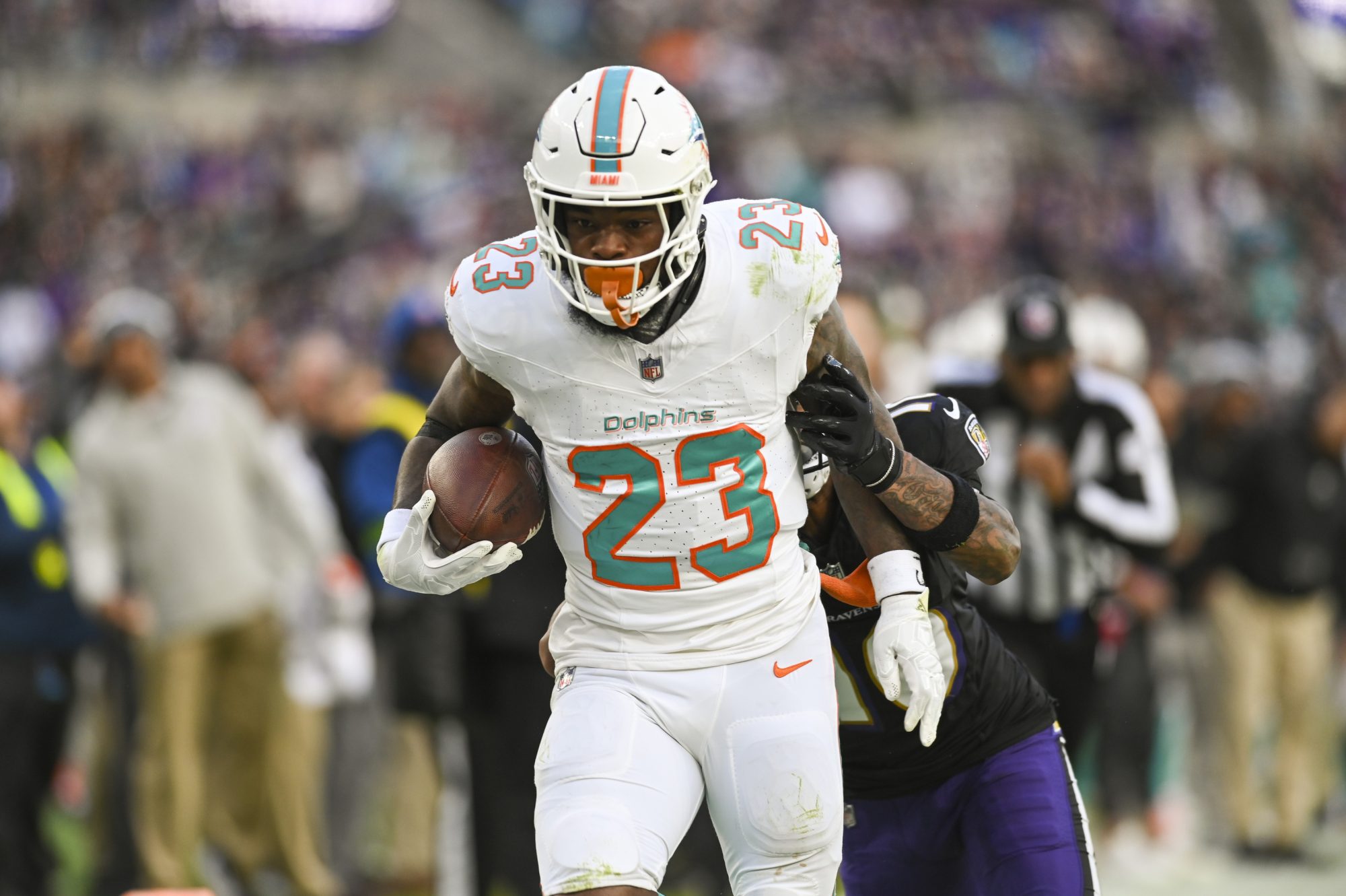 Dec 31, 2023; Baltimore, Maryland, USA; Miami Dolphins running back Jeff Wilson Jr. (23) rushes during the second half against the Baltimore Ravens at M&T Bank Stadium. Baltimore Ravens defeated Miami Dolphins 56-19.