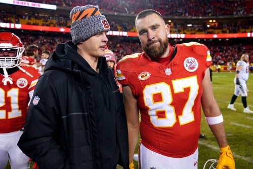 Cincinnati Bengals quarterback Joe Burrow (9), left, talks with Kansas City Chiefs tight end Travis Kelce (87) at the conclusion of a Week 17 NFL football game between the Cincinnati Bengals and the Kansas City Chiefs, Sunday, Dec. 31, 2023, at GEHA Field at Arrowhead Stadium in Kansas City, Mo. The Kansas City Chiefs won, 25-17.