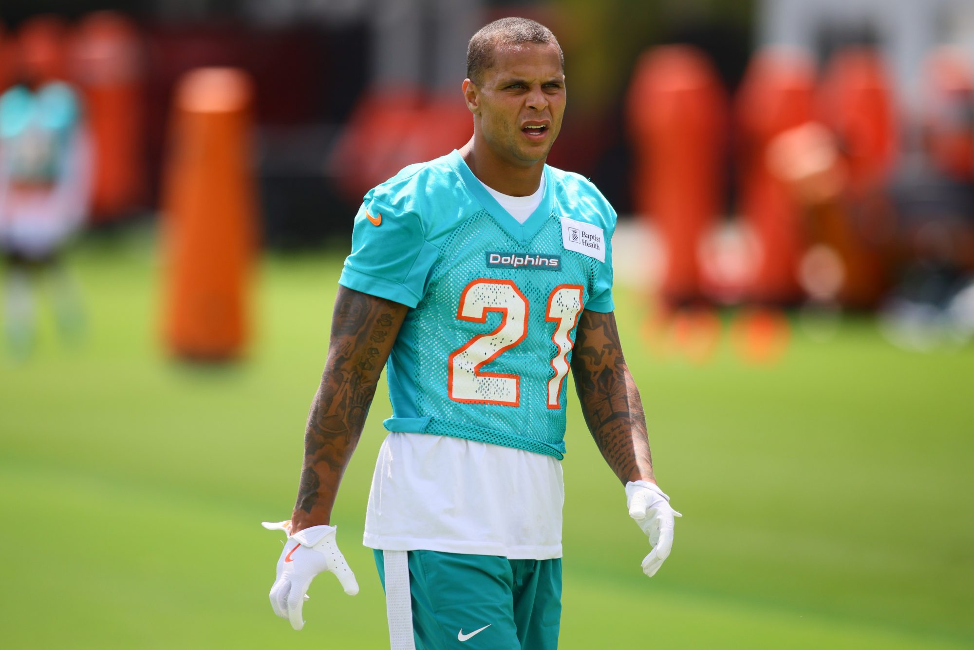 Jun 4, 2024; Miami Gardens, FL, USA; Miami Dolphins safety Jordan Poyer (21) works out during mandatory minicamp at Baptist Health Training Complex.