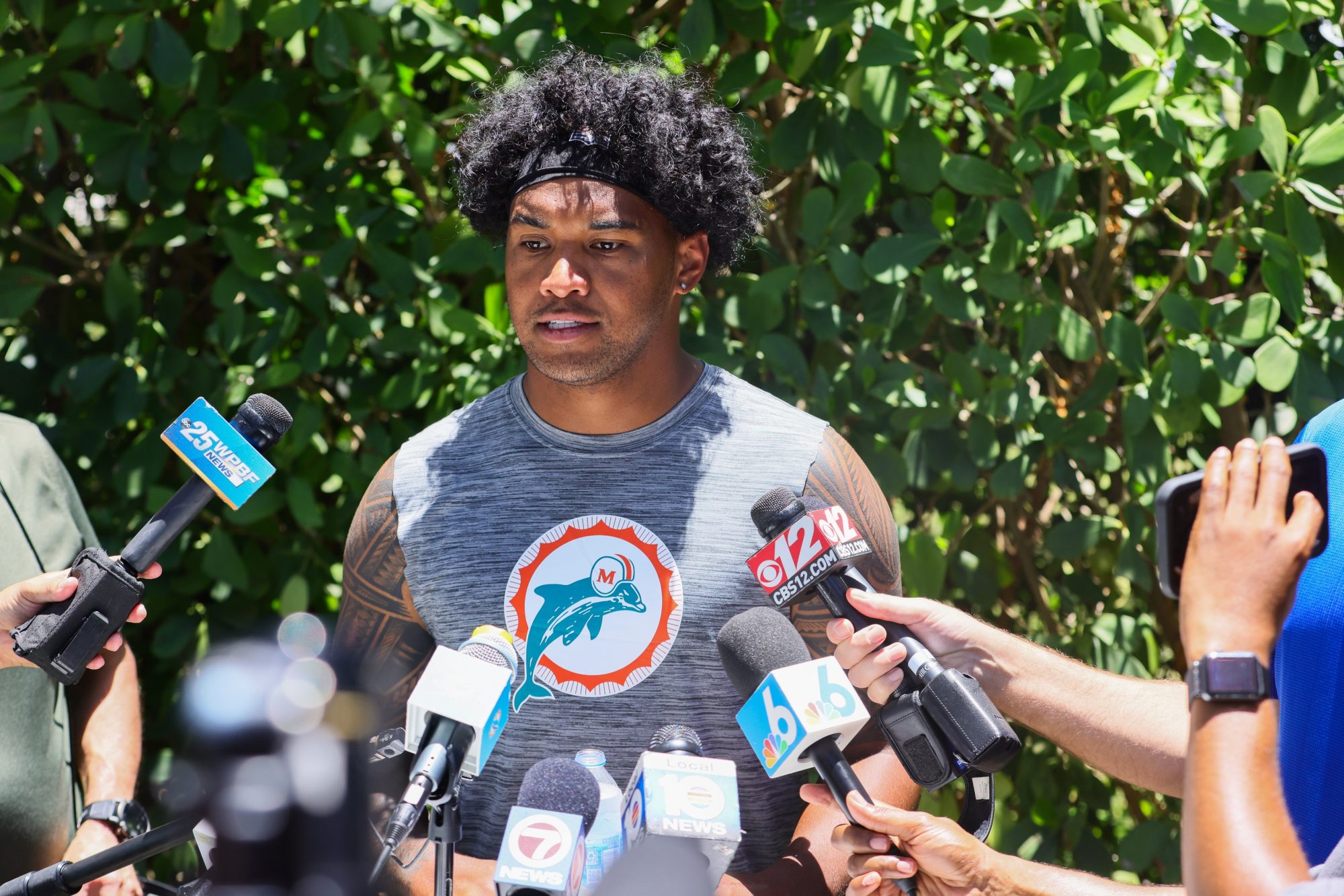 Jun 4, 2024; Miami Gardens, FL, USA; Miami Dolphins quarterback Tua Tagovailoa (1) speaks to reporters during mandatory minicamp at Baptist Health Training Complex.