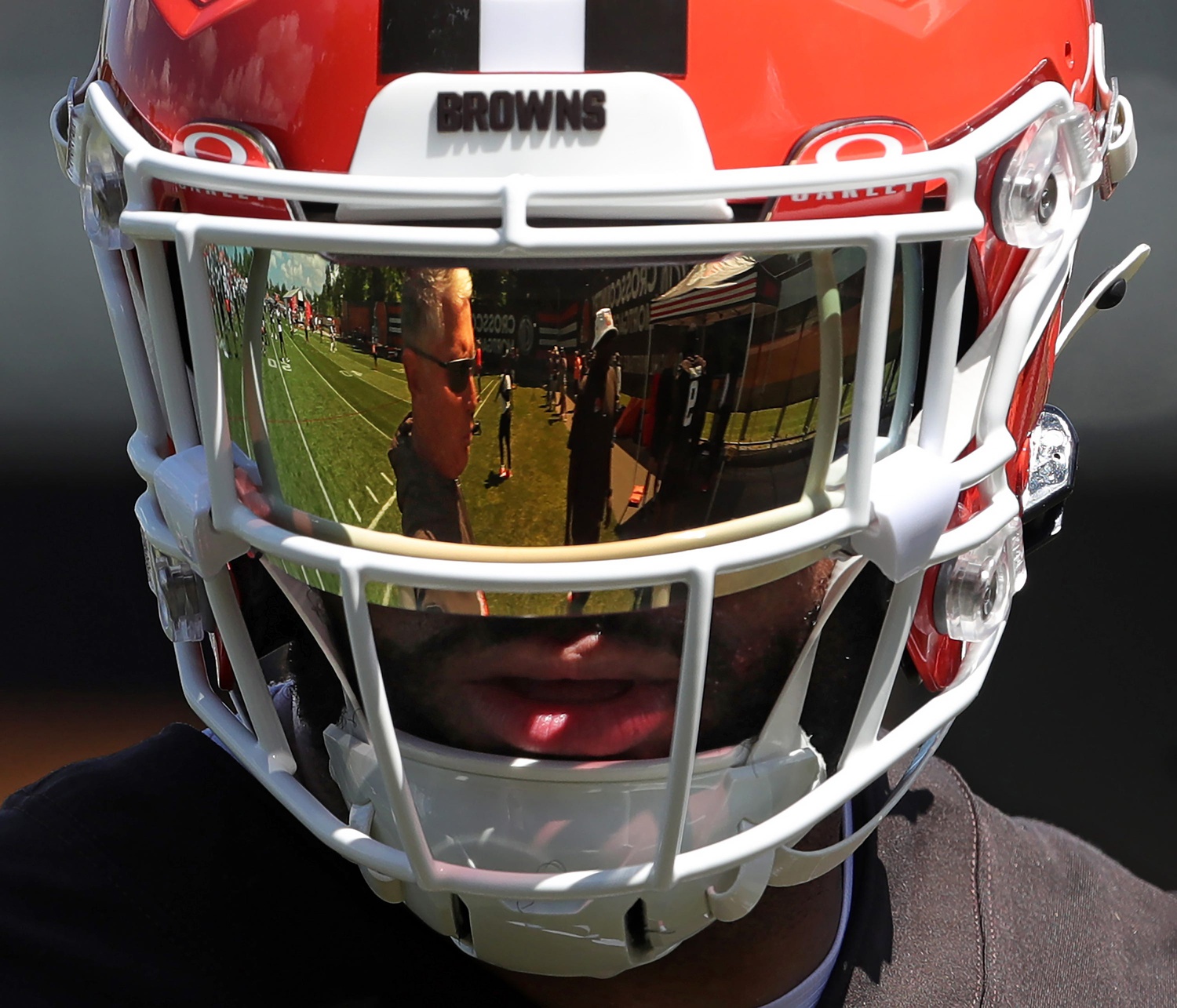 Browns defensive coordinator Jim Schwartz is reflected in safety Juan Thornhill's visor during minicamp, Tuesday, June 11, 2024, in Berea.