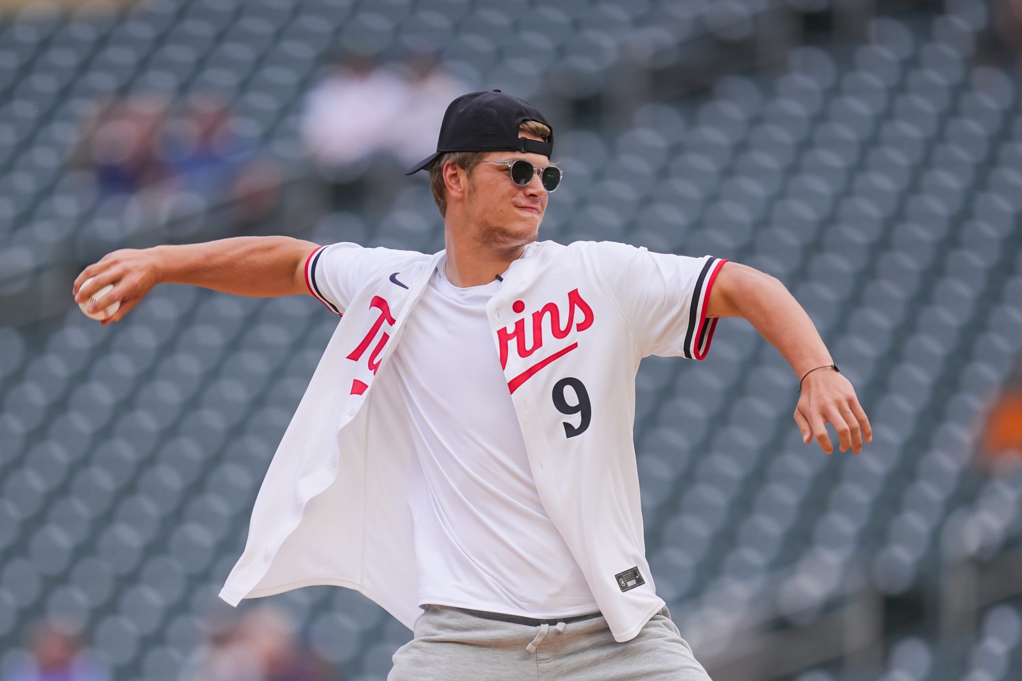 Jun 18, 2024; Minneapolis, Minnesota, USA; Minnesota Vikings first round draft pick JJ McCarthy throws out the ceremonial first pitch in a game between the Minnesota Twins and Tampa Bay Rays at Target Field.