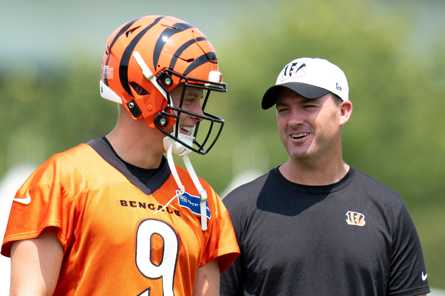 Cincinnati Bengals quarterback Joe Burrow (9) talks with Cincinnati Bengals head coach Zac Taylor during Cincinnati Bengals training camp in Cincinnati on Friday, July 26, 2024.