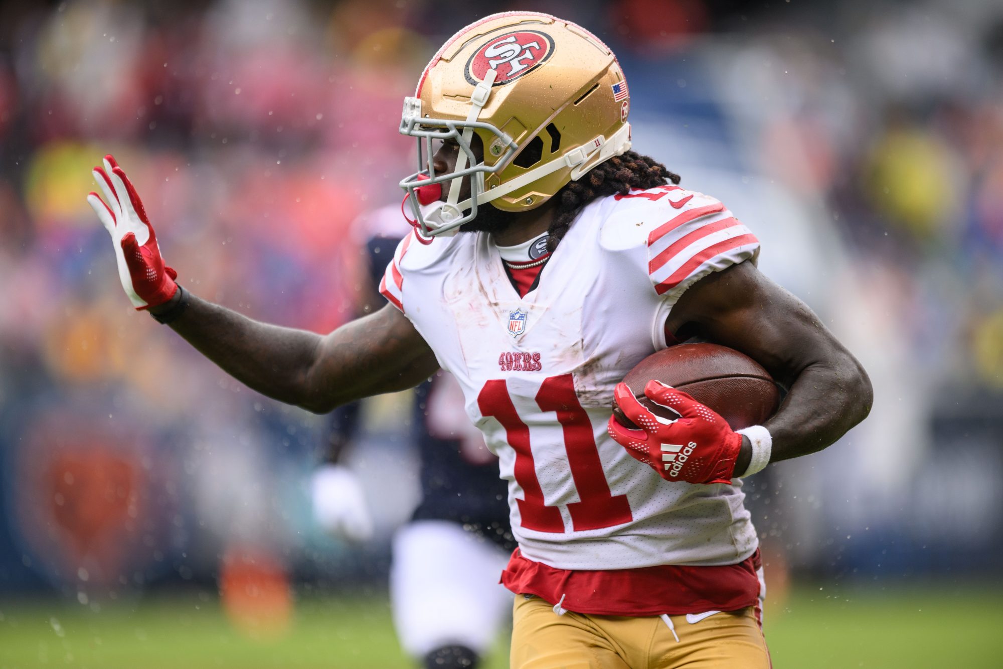 Sep 11, 2022; Chicago, Illinois, USA; San Francisco 49ers wide receiver Brandon Aiyuk (11) runs after a catch in the first quarter against the Chicago Bears at Soldier Field.