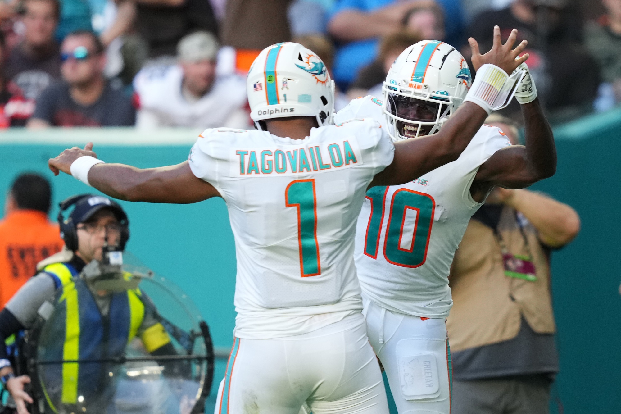 Nov 13, 2022; Miami Gardens, Florida, USA; Miami Dolphins wide receiver Tyreek Hill (10) celebrates the touchdown of running back quarterback Tua Tagovailoa (1) during the second half at Hard Rock Stadium.