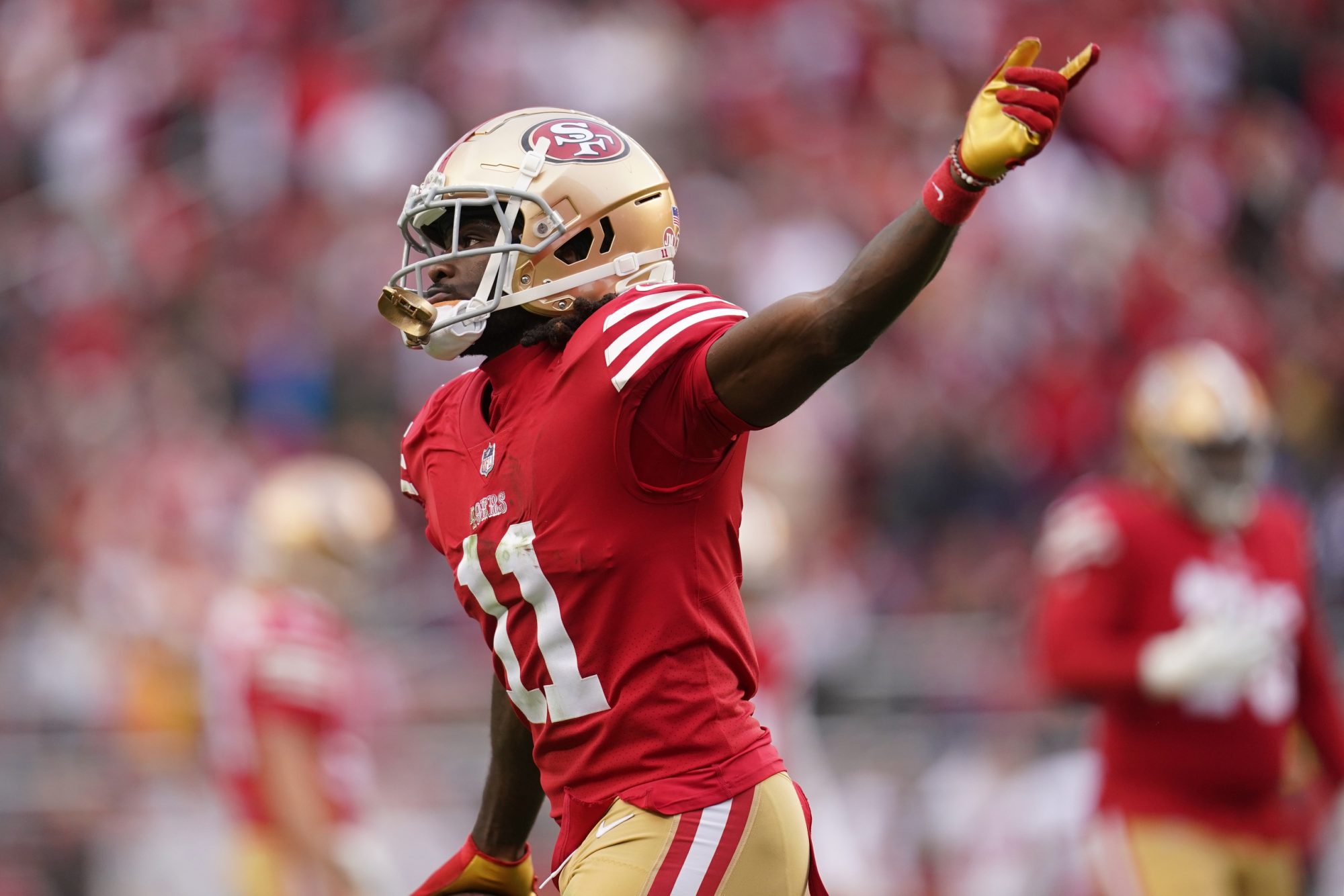 Dec 11, 2022; Santa Clara, California, USA; San Francisco 49ers wide receiver Brandon Aiyuk (11) celebrates after catching a touchdown pass against the Tampa Bay Buccaneers in the second quarter at Levi's Stadium.