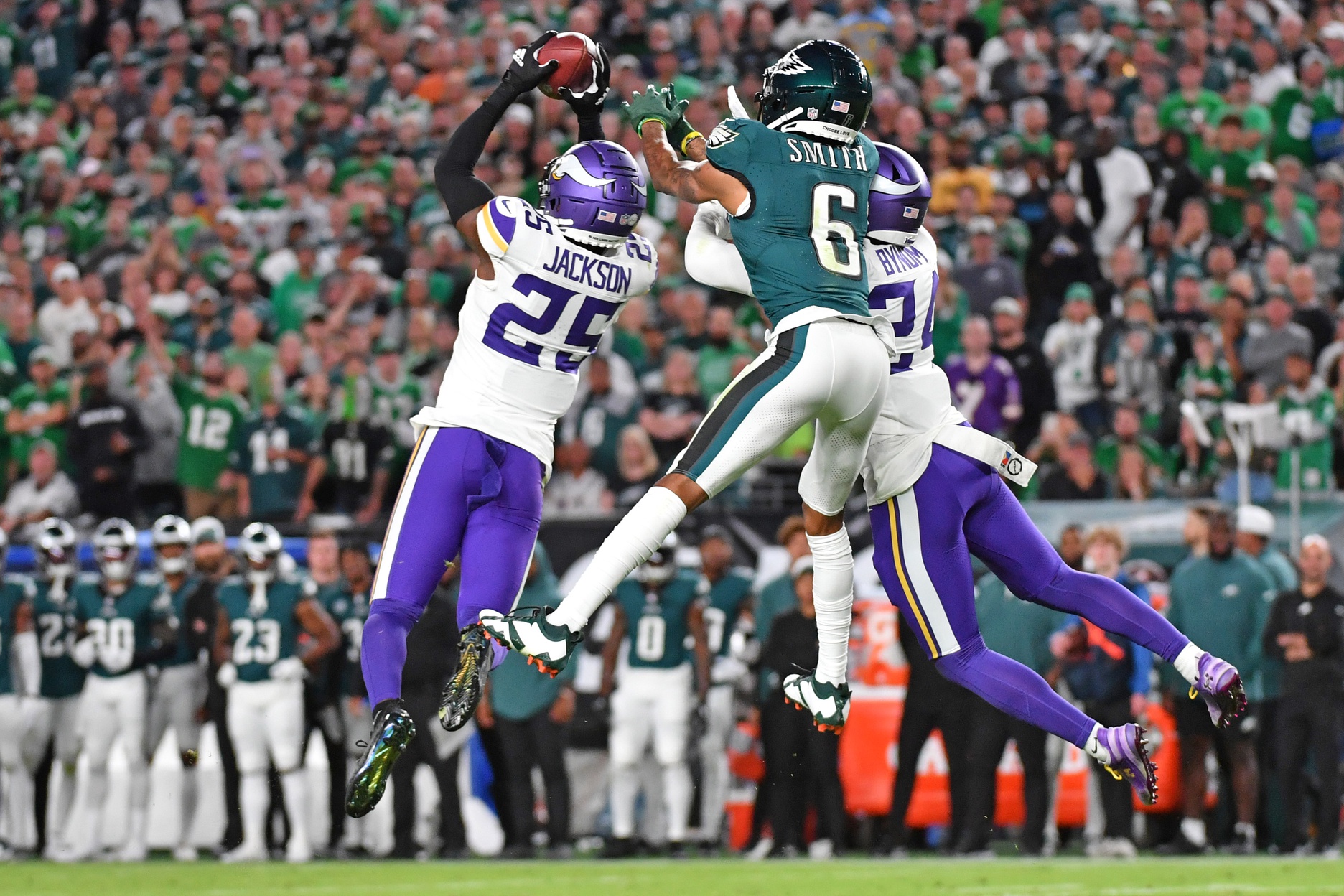 Sep 14, 2023; Philadelphia, Pennsylvania, USA; Minnesota Vikings safety Theo Jackson (25) intercepts pass intended for Philadelphia Eagles wide receiver DeVonta Smith (6) during the first quarter at Lincoln Financial Field.