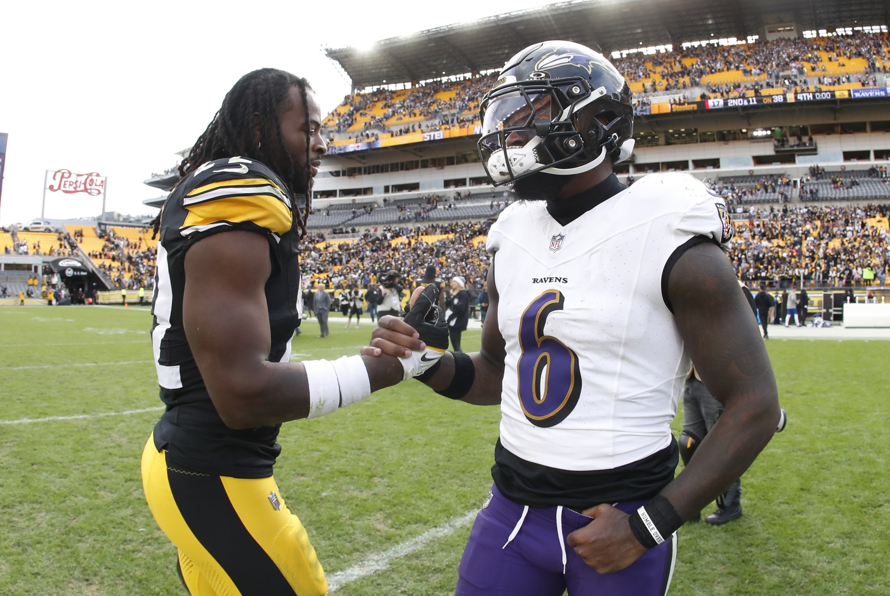 Oct 8, 2023; Pittsburgh, Pennsylvania, USA; Pittsburgh Steelers running back Najee Harris (22) and Baltimore Ravens linebacker Patrick Queen (6) shake hands after their game at Acrisure Stadium. Pittsburgh won 17-10.