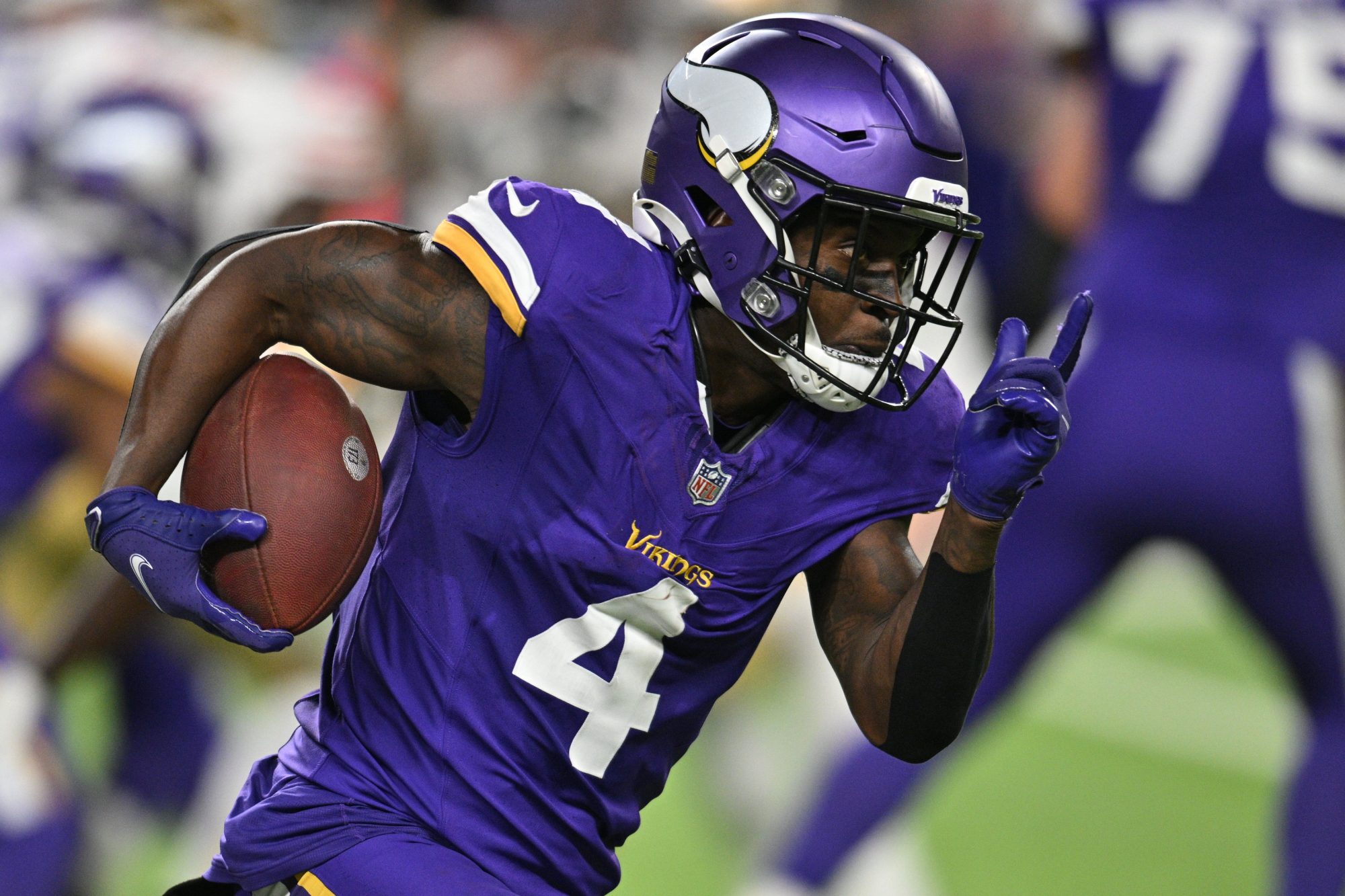 Oct 23, 2023; Minneapolis, Minnesota, USA; Minnesota Vikings wide receiver Brandon Powell (4) runs the ball against the San Francisco 49ers during the third quarter at U.S. Bank Stadium.