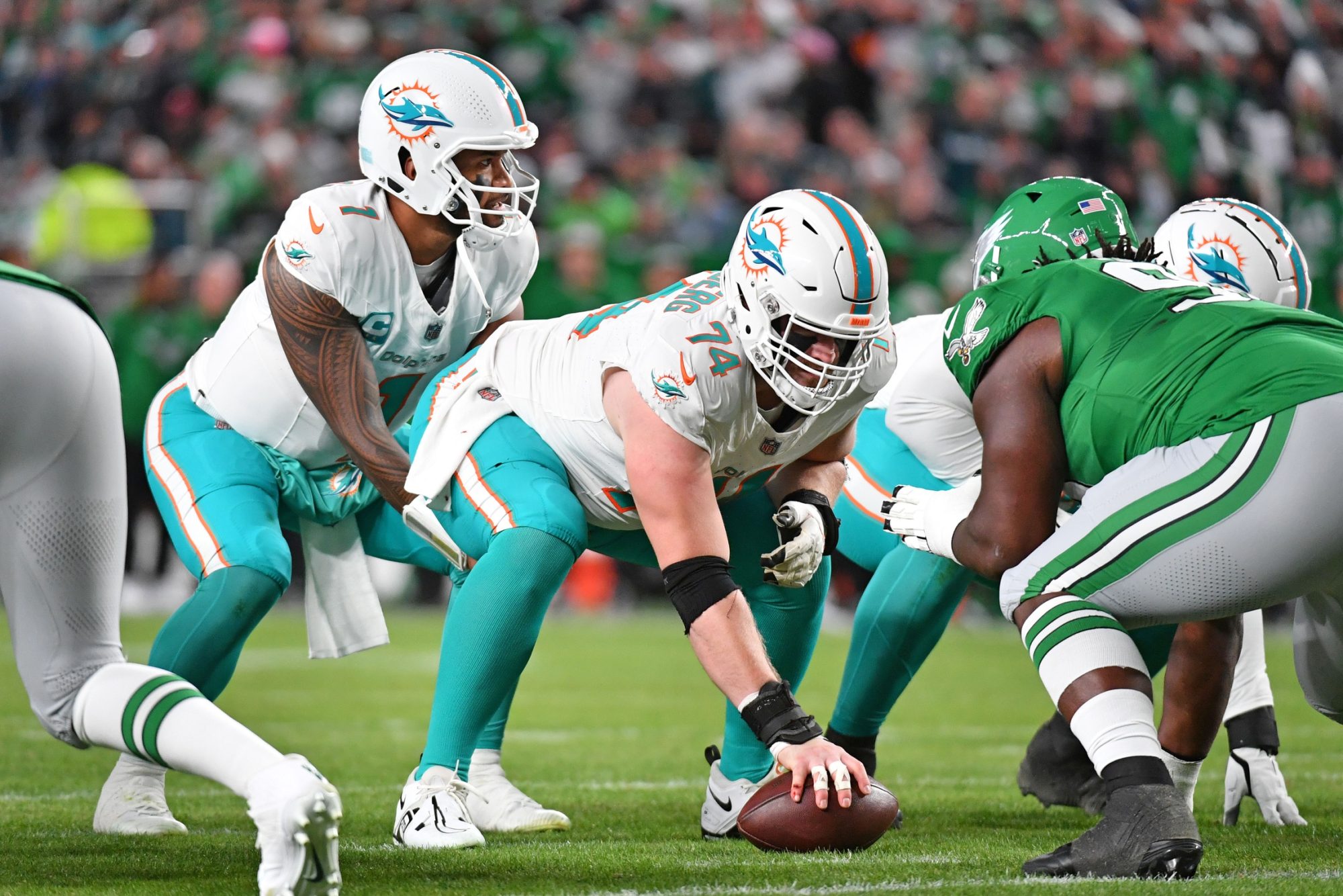 Oct 22, 2023; Philadelphia, Pennsylvania, USA; Miami Dolphins offensive tackle Liam Eichenberg (74) snaps the ball to quarterback Tua Tagovailoa (1) against the Philadelphia Eagles at Lincoln Financial Field.