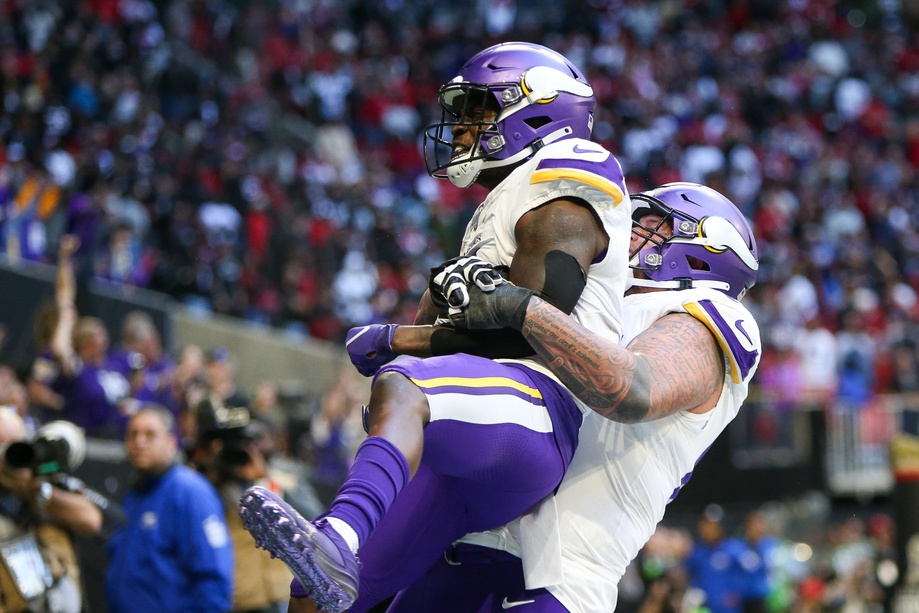 Nov 5, 2023; Atlanta, Georgia, USA; Minnesota Vikings wide receiver Brandon Powell (4) celebrates after a touchdown with guard Dalton Risner (66) against the Atlanta Falcons in the second half at Mercedes-Benz Stadium.