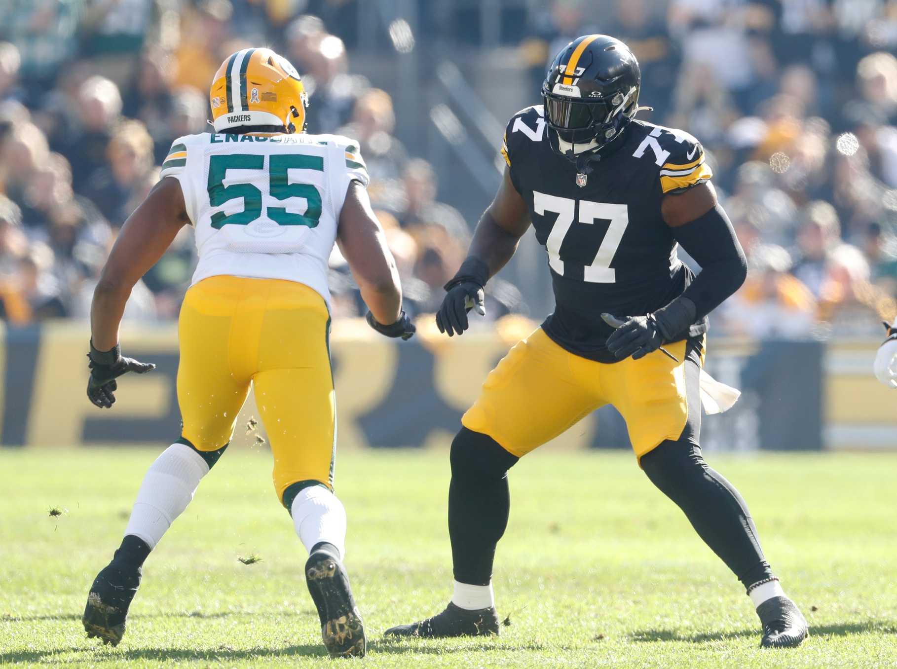 Nov 12, 2023; Pittsburgh, Pennsylvania, USA; Pittsburgh Steelers offensive tackle Broderick Jones (77) blocks at the line of scrimmage against Green Bay Packers linebacker Kingsley Enagbare (55) during the first quarter at Acrisure Stadium.