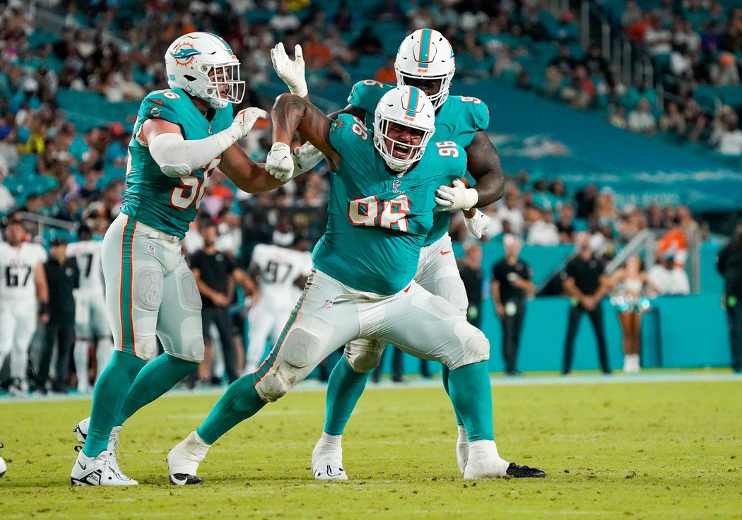 Miami Dolphins defensive tackle Brandon Pili (96) celebrates a tackle for loss during the fourth quarter of a preseason game at Hard Rock Stadium on Friday, August 11, 2023, in Miami Gardens, FL.