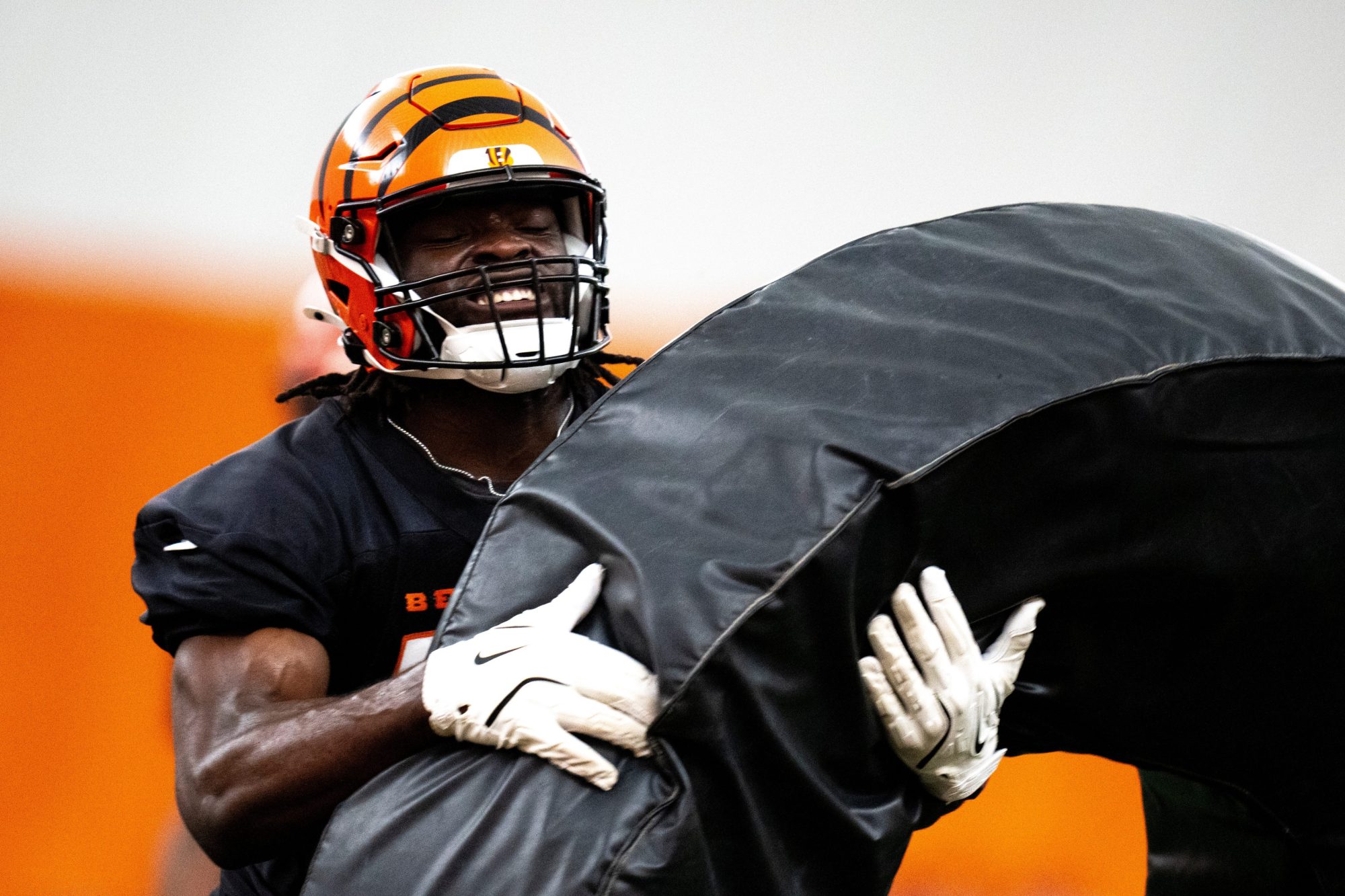 Cincinnati Bengals linebacker Maema Njongmeta (45) hits a pad during a drill at Bengals spring practice at the IEL Indoor Facility in Cincinnati on Tuesday, June 11, 2024.