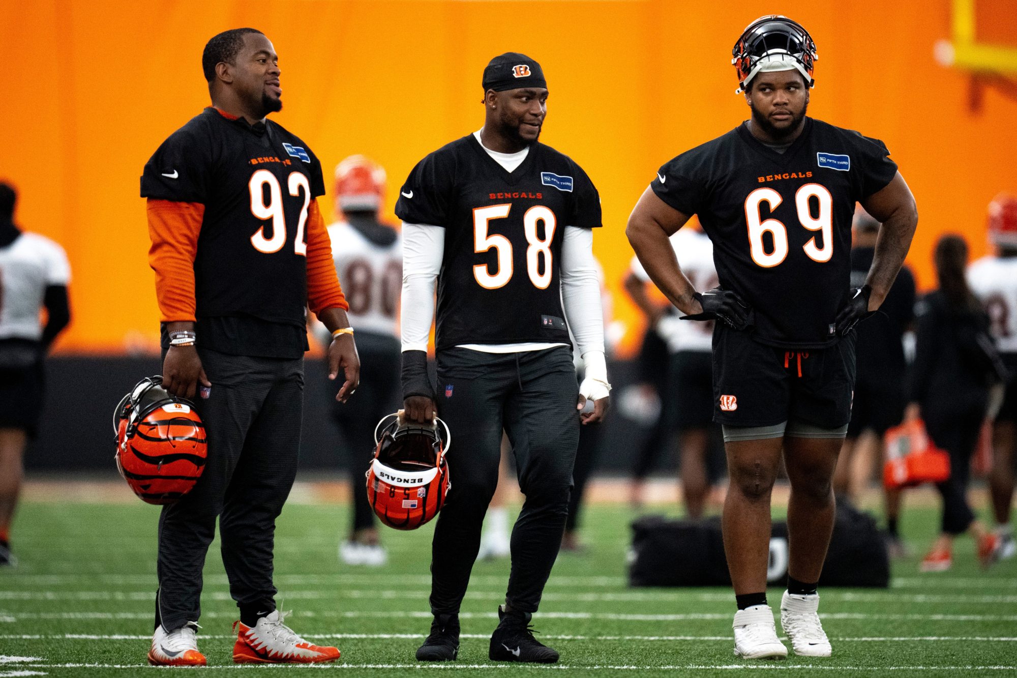 Cincinnati Bengals defensive tackle Jay Tufele (97), Cincinnati Bengals defensive end Joseph Ossai (58) and Cincinnati Bengals defensive tackle Devonnsha Maxwell (69) stand together at Bengals spring practice at the IEL Indoor Facility in Cincinnati on Tuesday, June 11, 2024.