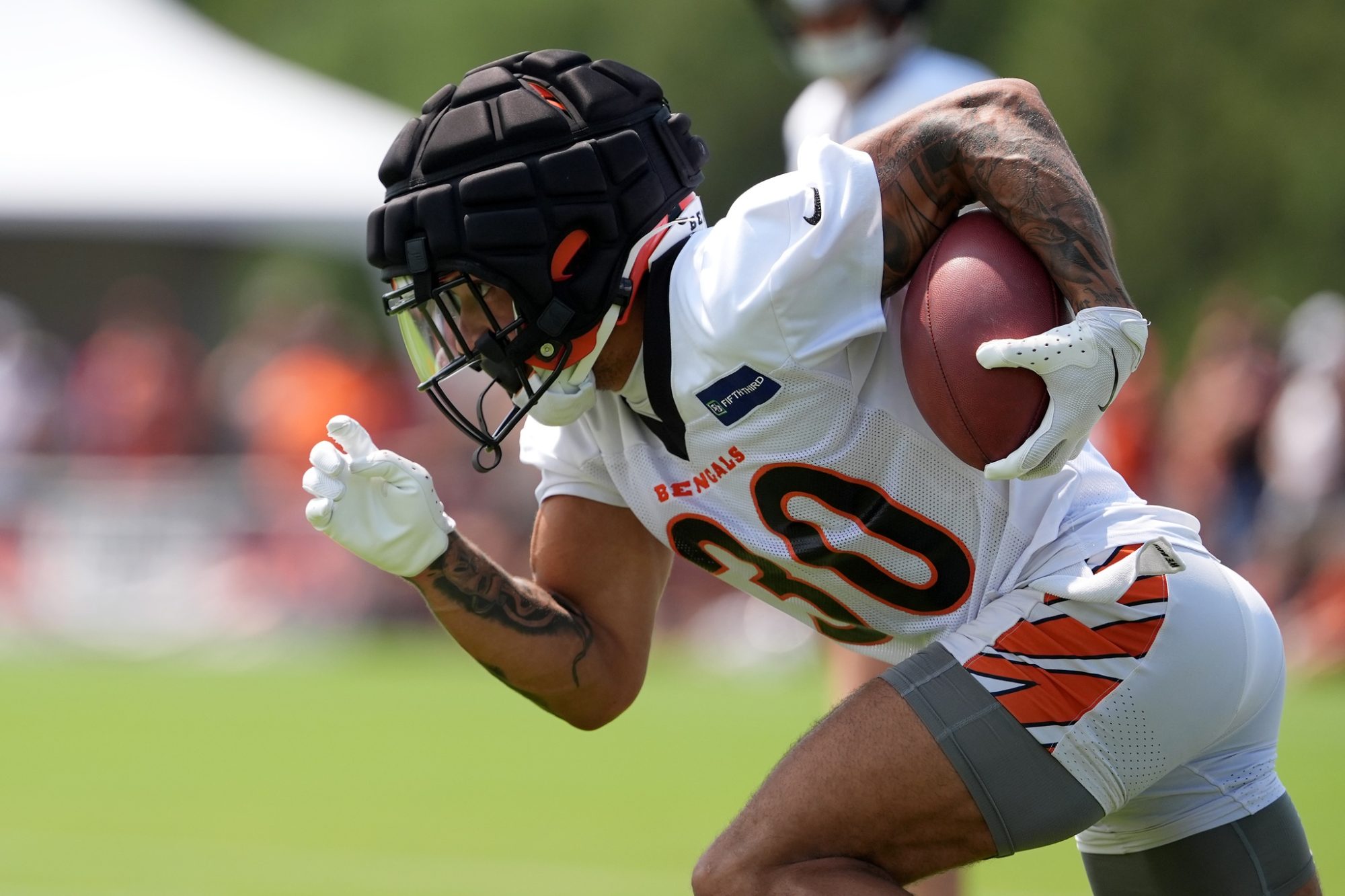 Jul 26, 2024; Cincinnati, OH, USA; Cincinnati Bengals running back Chase Brown (30) returns a kick off during training camp practice at Kettering Health Practice Fields.