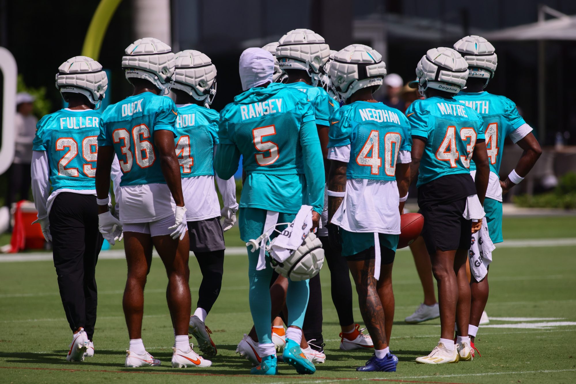 Jul 28, 2024; Miami Gardens, FL, USA; Miami Dolphins cornerbacks work out during training camp at Baptist Health Training Complex.