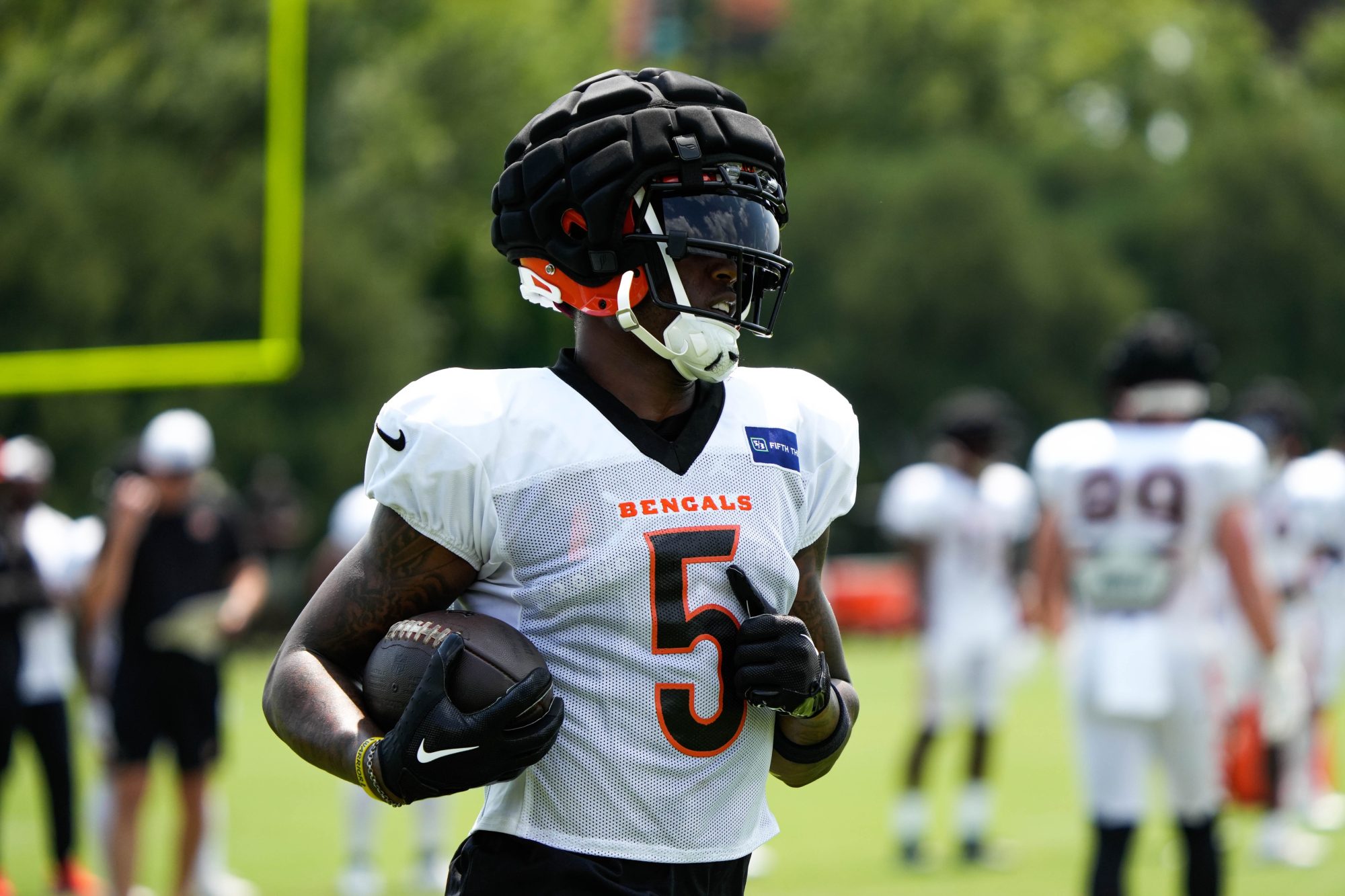 Bengals Tee Higgins runs the ball during their training camp on Tuesday July 30, 2024.