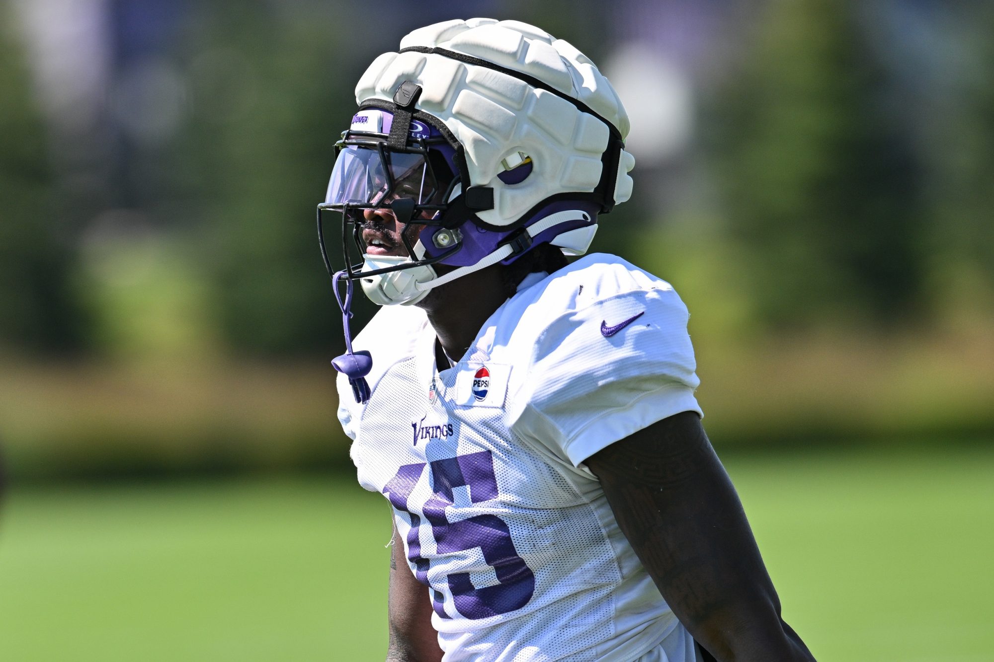 Aug 2, 2024; Eagan, MN, USA; Minnesota Vikings rookie linebacker Dallas Turner (15) warms up during practice at Vikings training camp in Eagan, MN.