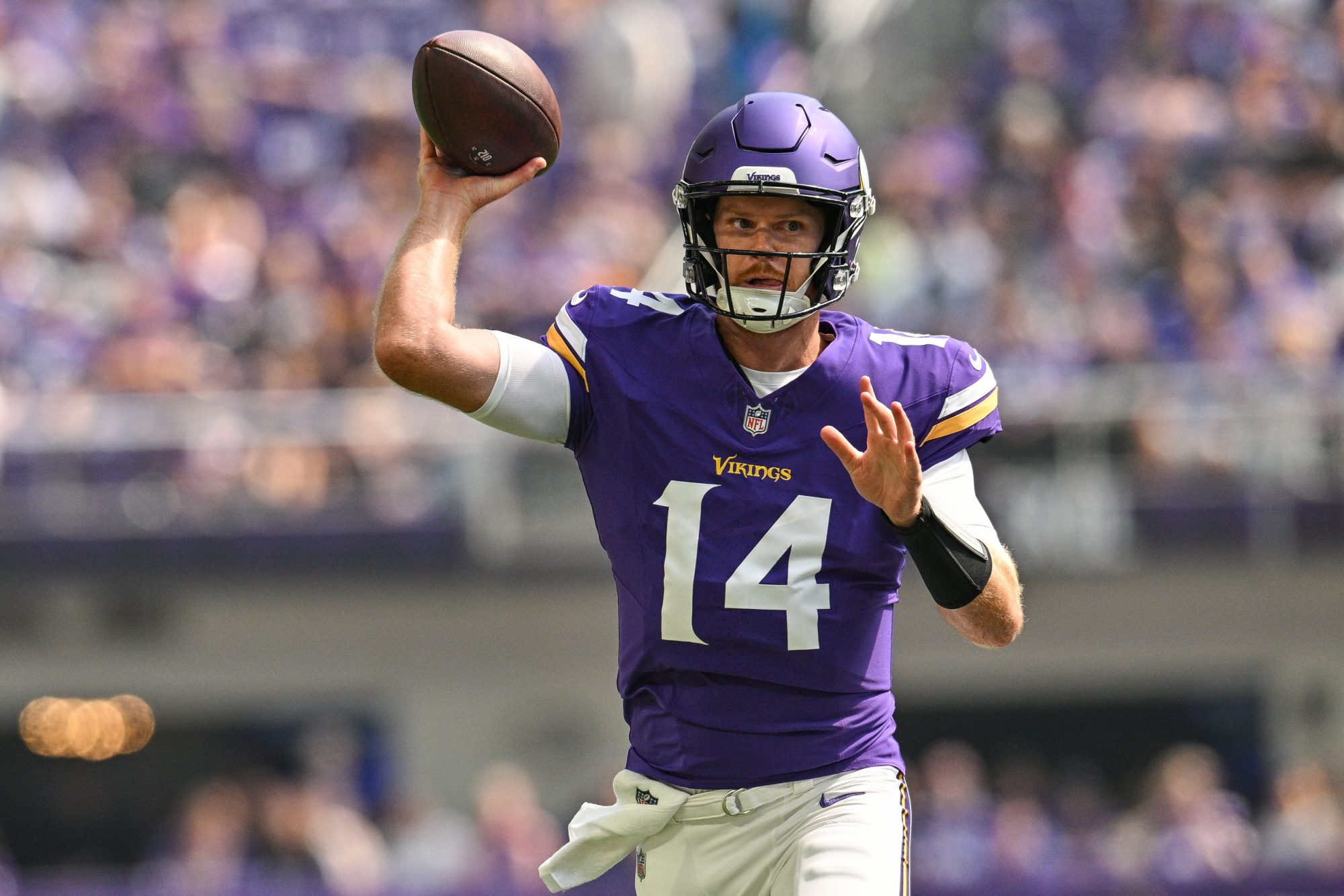 Aug 10, 2024; Minneapolis, Minnesota, USA; Minnesota Vikings quarterback Sam Darnold (14) throws a pass against the Las Vegas Raiders during the first quarter at U.S. Bank Stadium.