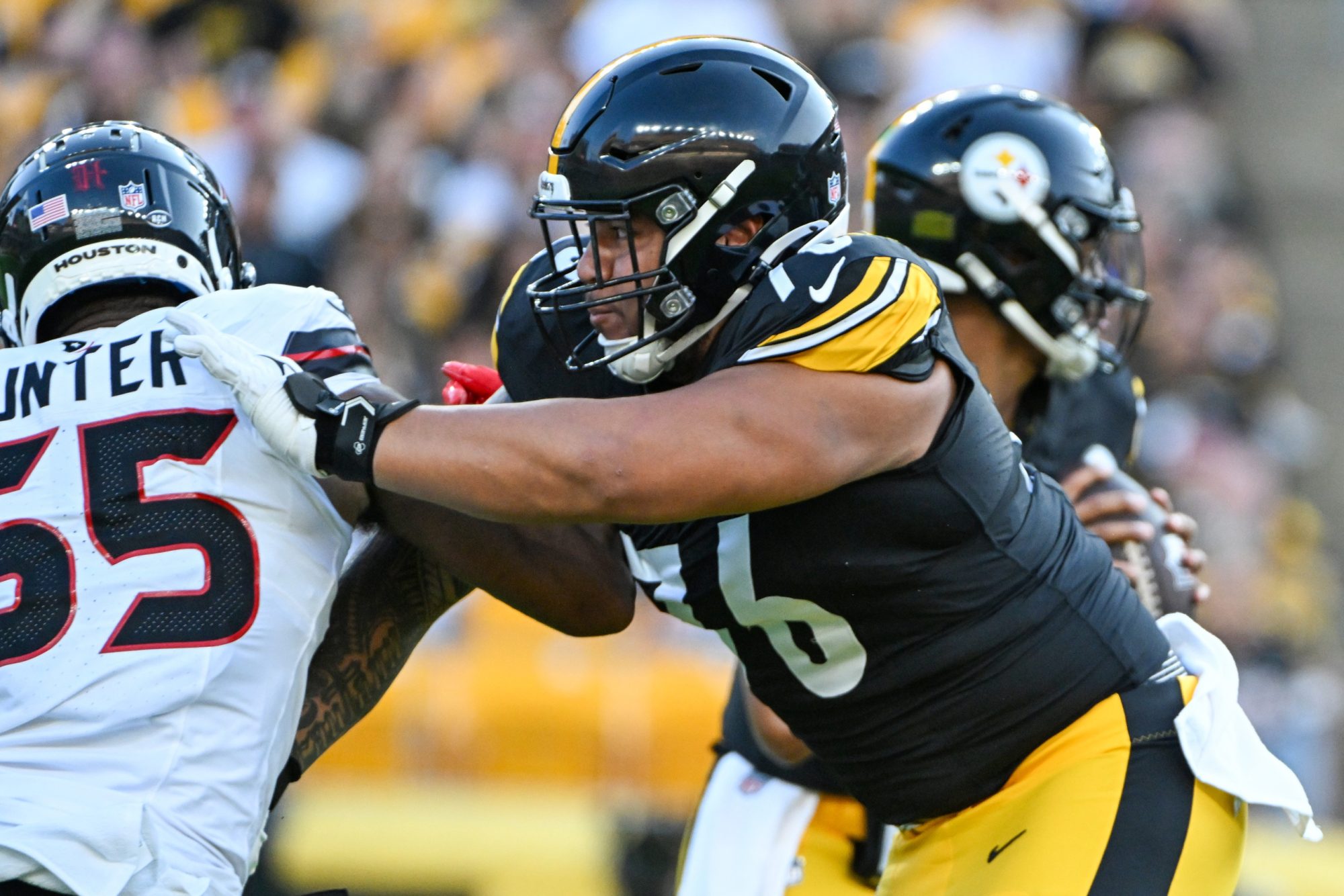 Aug 9, 2024; Pittsburgh, Pennsylvania, USA; Pittsburgh Steelers offensive tackle Troy Fautanu (76) blocks Houston Texans defensive end Danielle Hunter (55) during the first quarter at Acrisure Stadium.