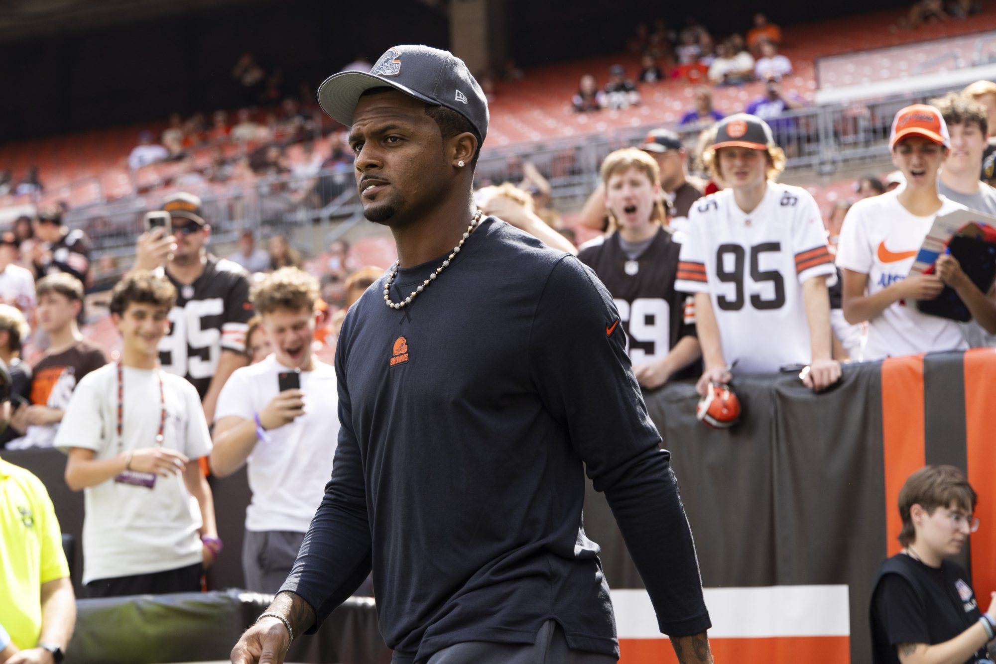 Aug 17, 2024; Cleveland, Ohio, USA; Cleveland Browns quarterback Deshaun Watson (4) walks out to the field before the game against the Minnesota Vikings at Cleveland Browns Stadium.