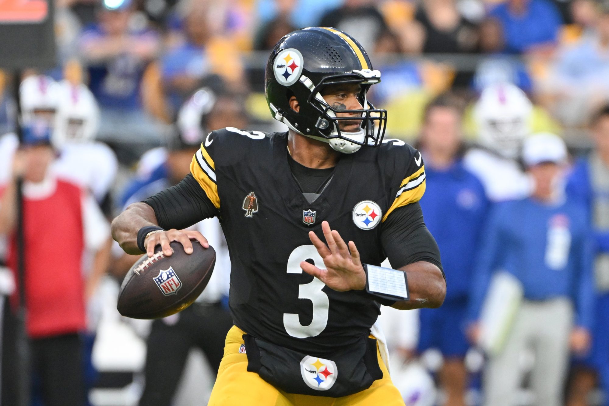 Aug 17, 2024; Pittsburgh, Pennsylvania, USA; Pittsburgh Steelers quarterback Russell Wilson (3) looks to pass against the Buffalo Bills during the first quarter at Acrisure Stadium.