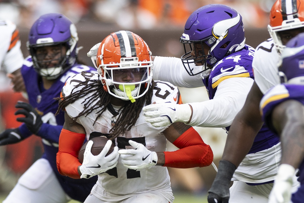 Aug 17, 2024; Cleveland, Ohio, USA; Cleveland Browns running back D'Onta Foreman (27) runs the ball as Minnesota Vikings defensive tackle Taki Taimani (94) tackles him during the third quarter at Cleveland Browns Stadium.