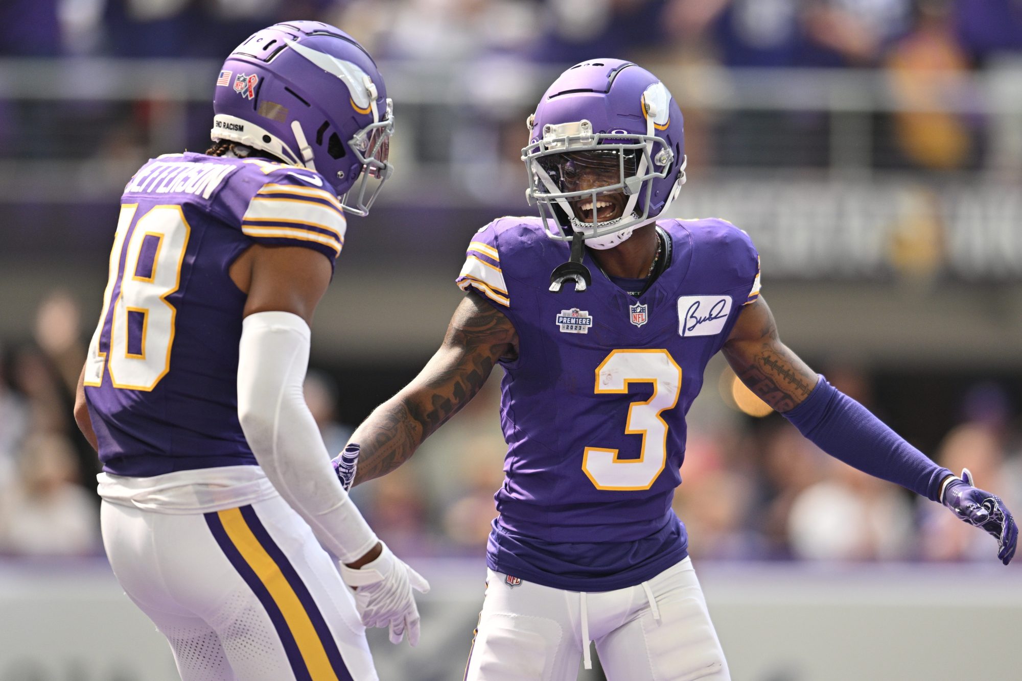 Sep 10, 2023; Minneapolis, Minnesota, USA; Minnesota Vikings wide receiver Jordan Addison (3) reacts with wide receiver Justin Jefferson (18) after scoring his first career touchdown pass from quarterback Kirk Cousins (not pictured) against the Tampa Bay Buccaneers during the second quarter at U.S. Bank Stadium.